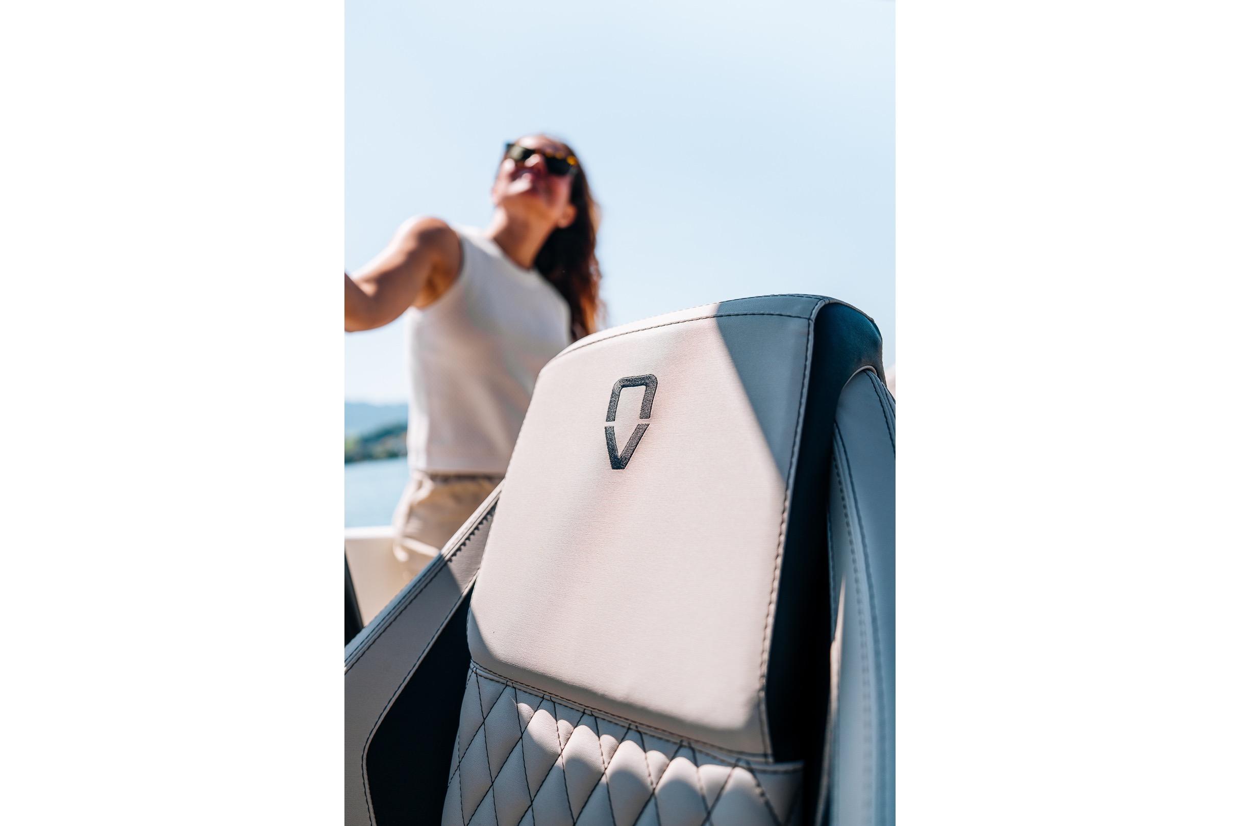 Luxury seat of 2026 Navan S30 boat with person enjoying the view.