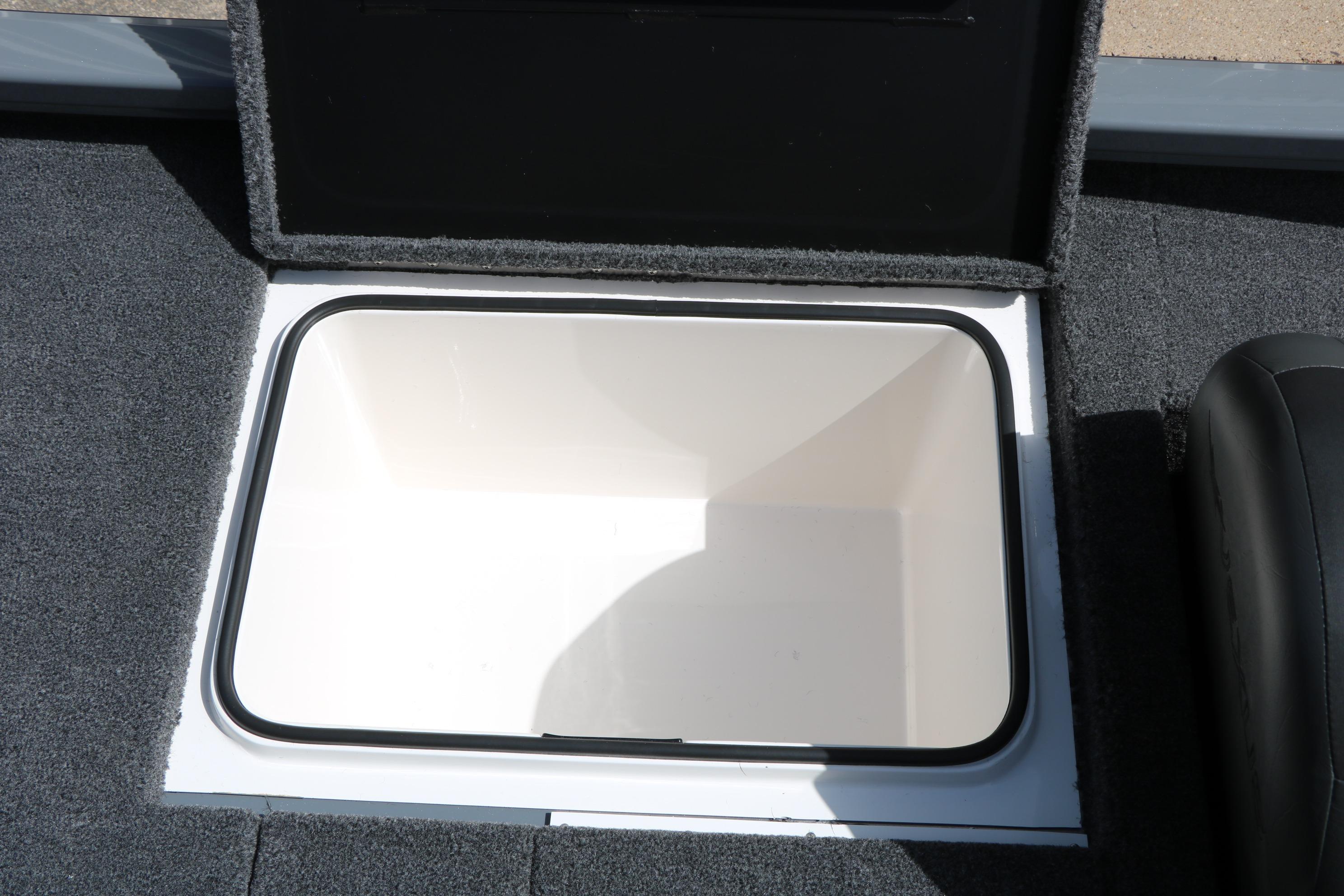 Open storage compartment in 2026 Vexus AVX1980 boat, featuring carpeted interior.