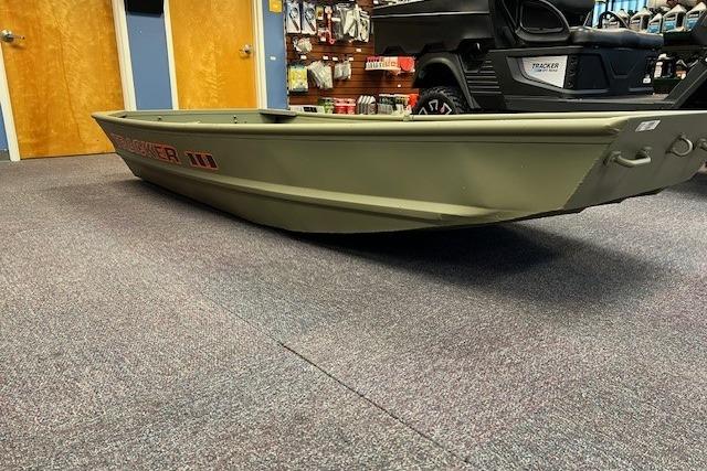 2026 Tracker Grizzly 10 Jon boat displayed indoors on carpeted floor.