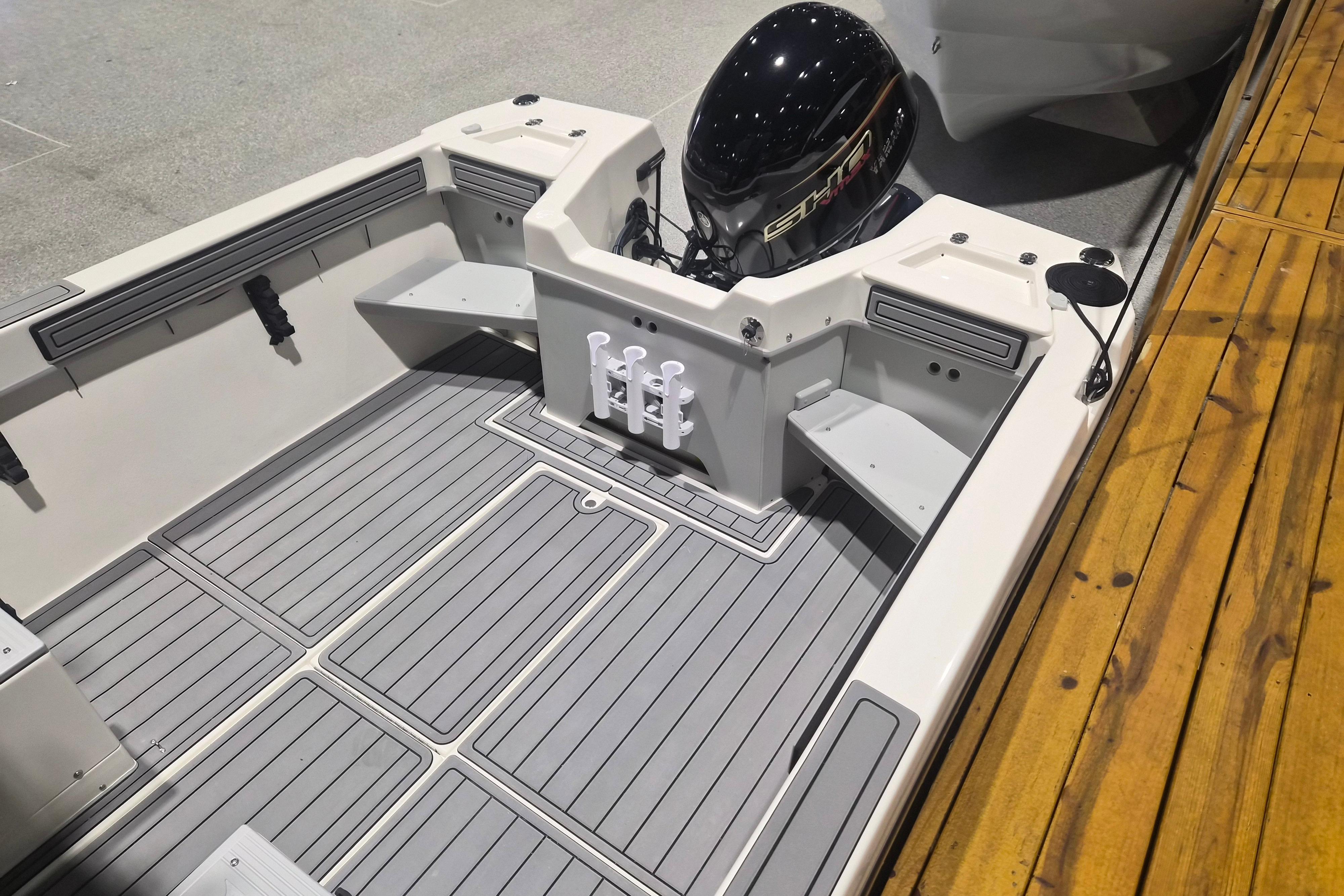 2026 Arima Sea Chaser 19 Yellowtail Edition boat interior with motor and deck view.