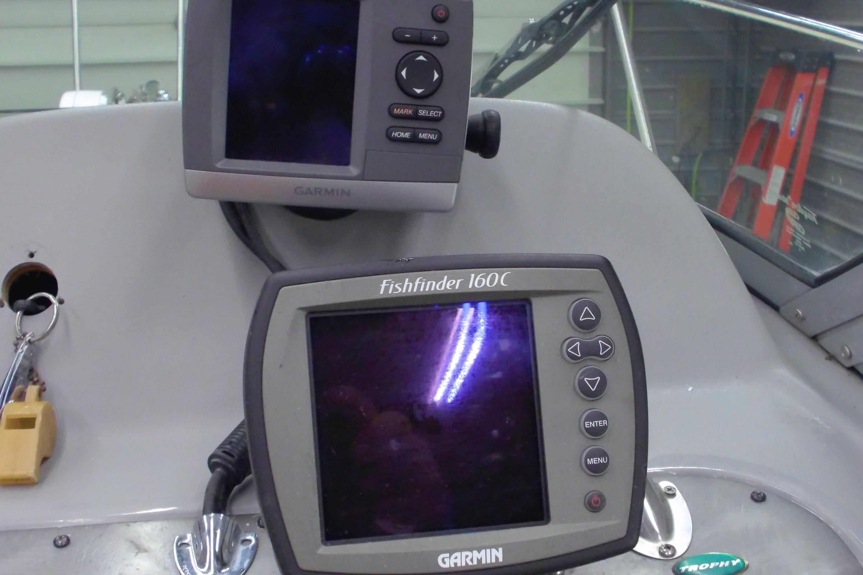 Garmin Fishfinder 160C and GPS on 2004 Trophy 2352 Walkaround boat dashboard.