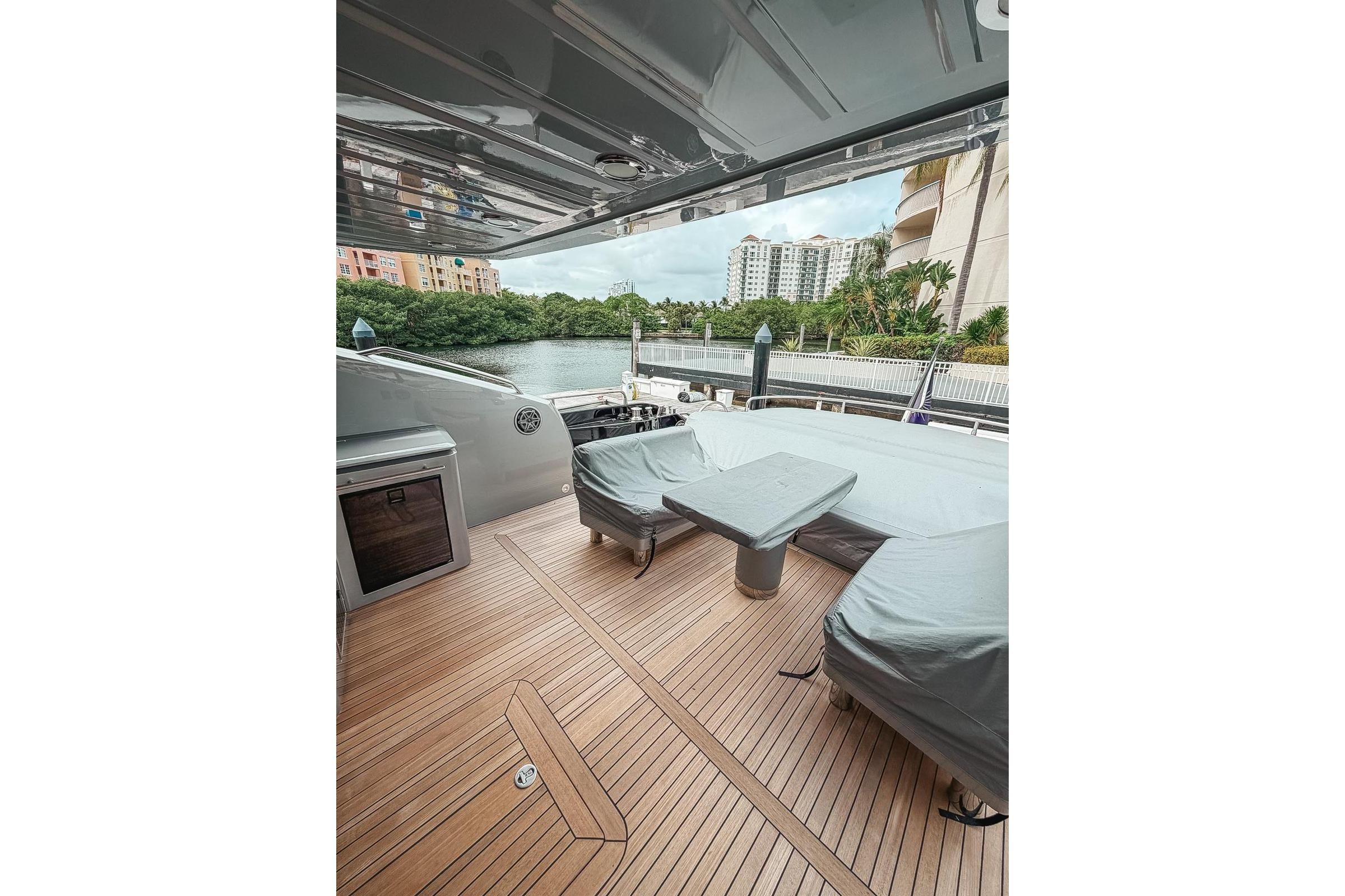 Luxurious Sunseeker Predator 84 yacht deck with covered seating, 2010 model.