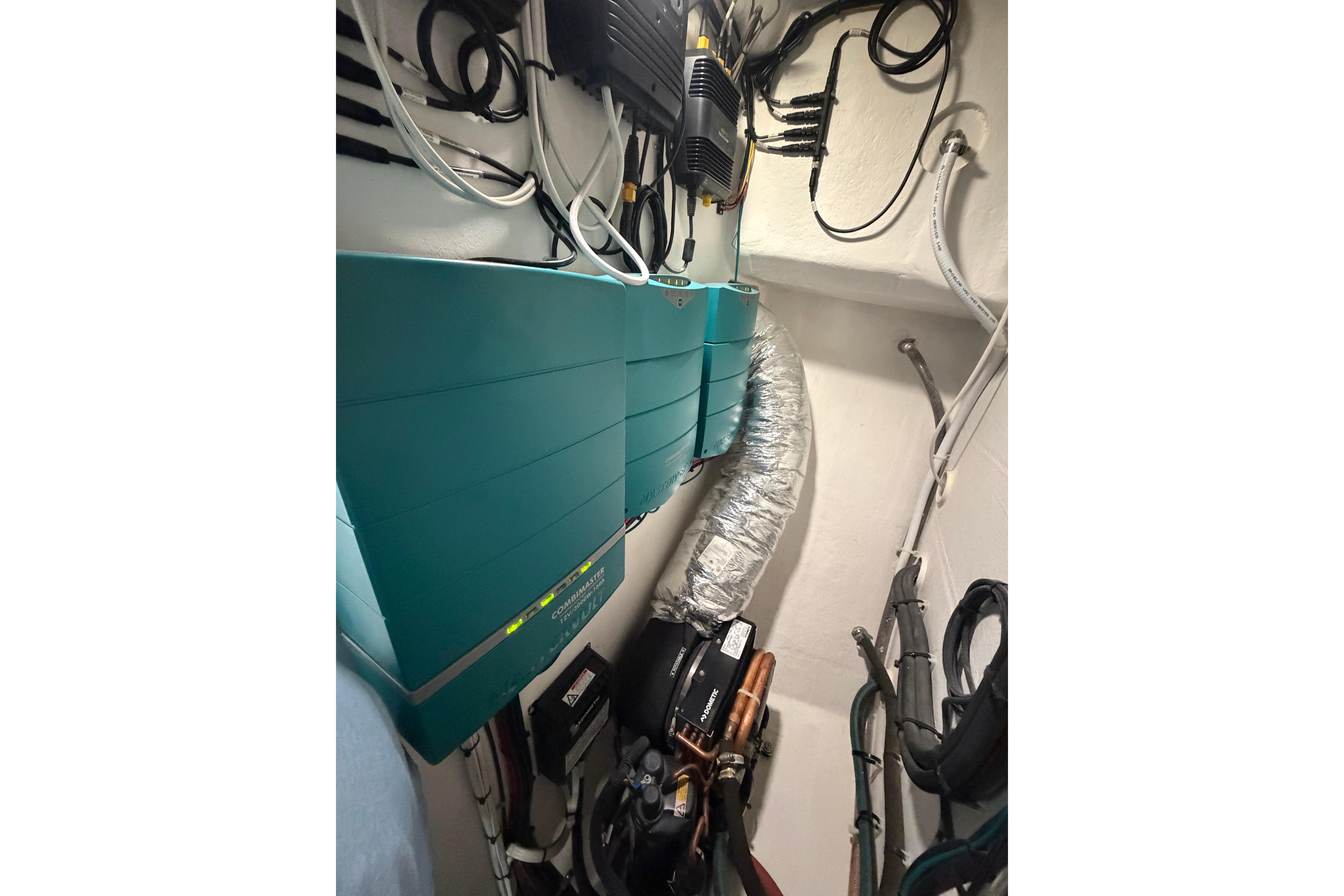 Electrical system inside a 2018 H&H Marine Osmond Beal boat, featuring wiring and components.