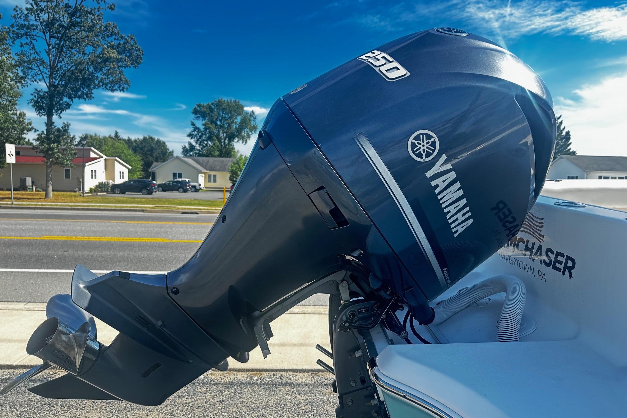 Yamaha outboard motor on a 2020 Tidewater 230 CC Adventure boat, parked roadside.