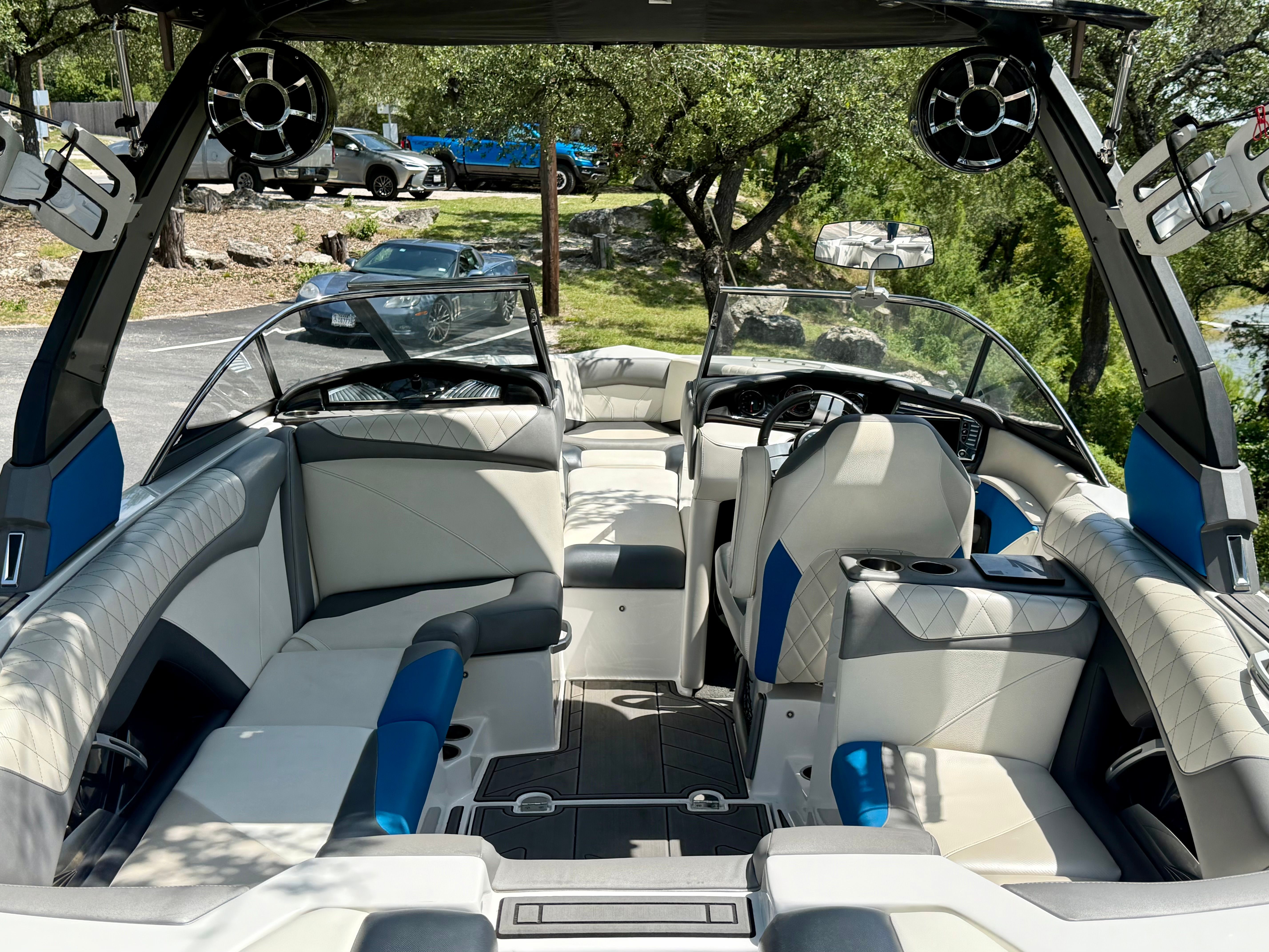 Interior view of a 2017 Tigé Z3 boat with white and blue seating and modern design.
