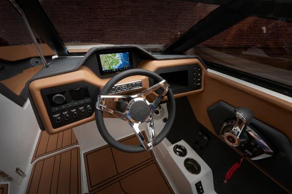 2025 Cobalt CS23 boat dashboard with modern steering wheel and navigation display.