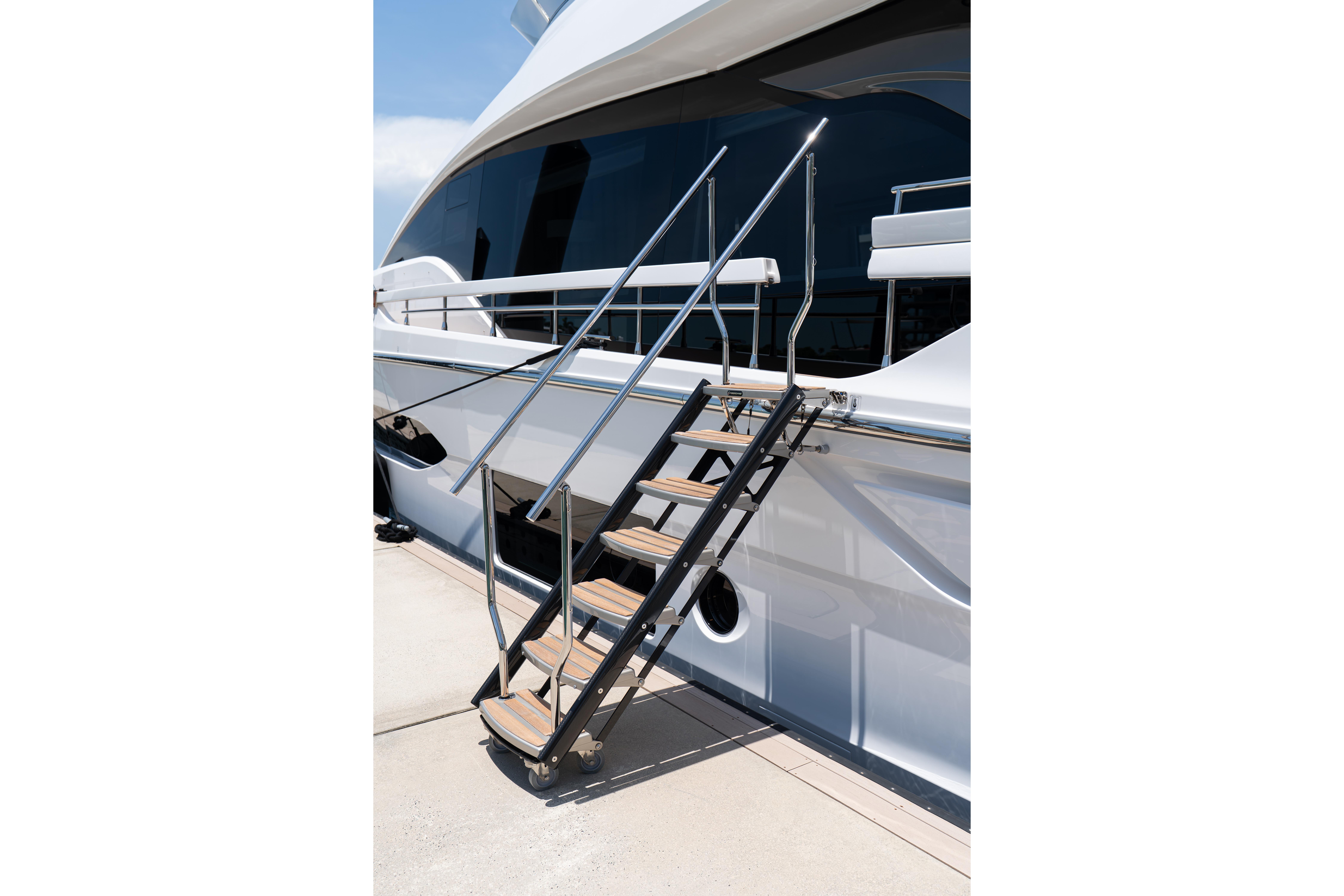Luxury Azimut 78 yacht with sleek exterior and elegant boarding stairs, 2022 model.