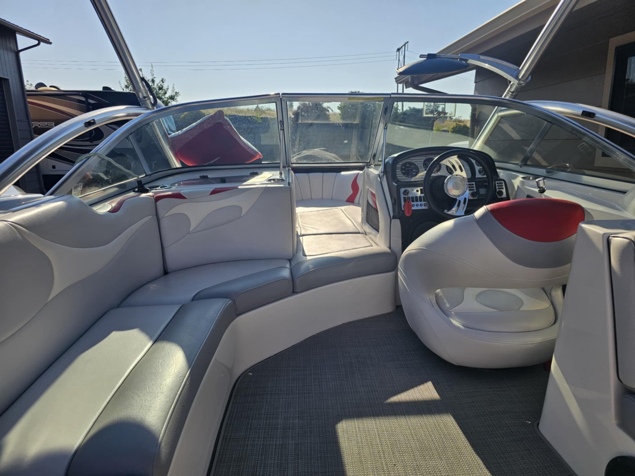 Interior of a 2006 MB PIGPR boat with gray and red seating.