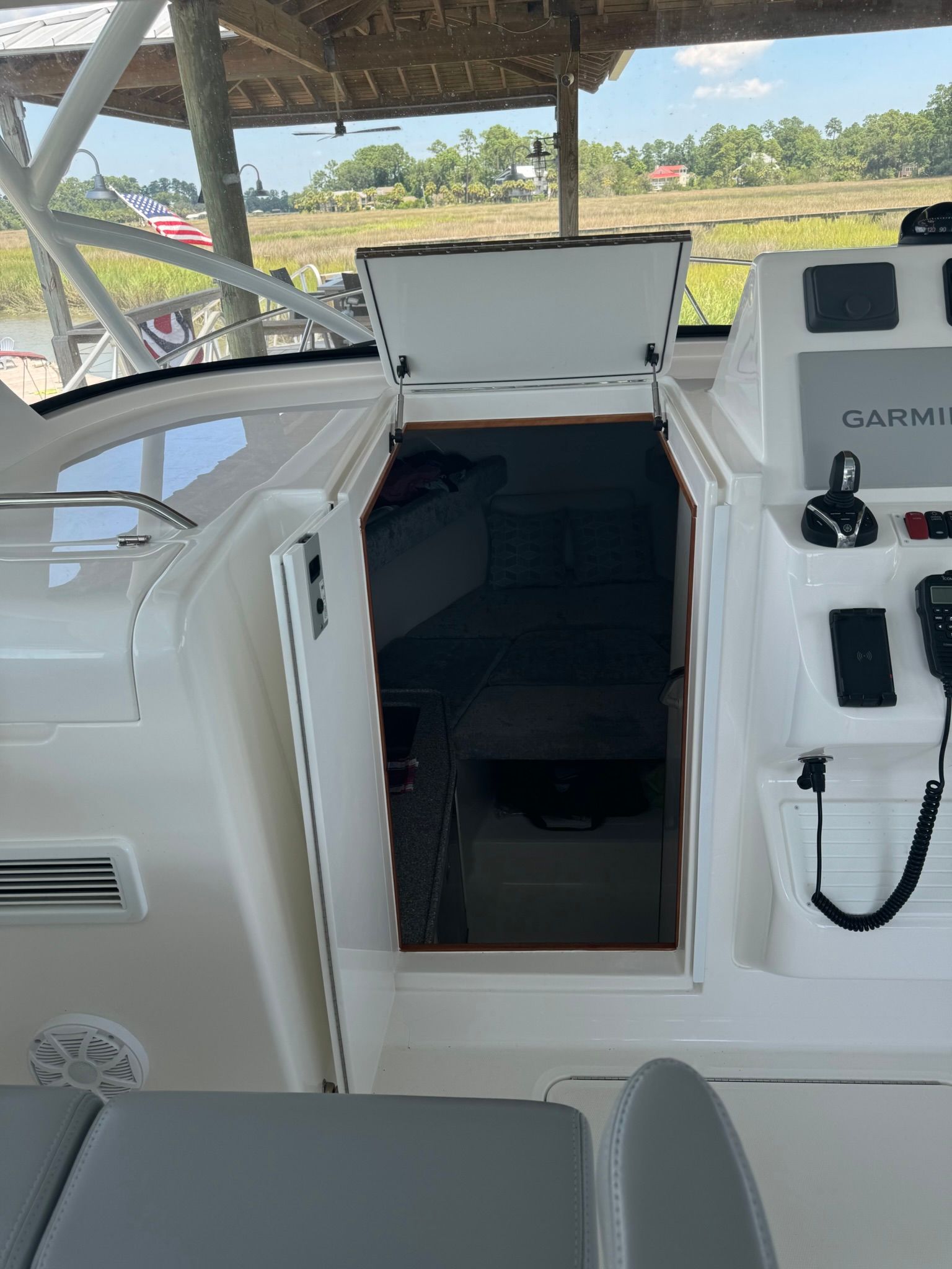2024 Albemarle 30 Express with open cabin door and helm console.