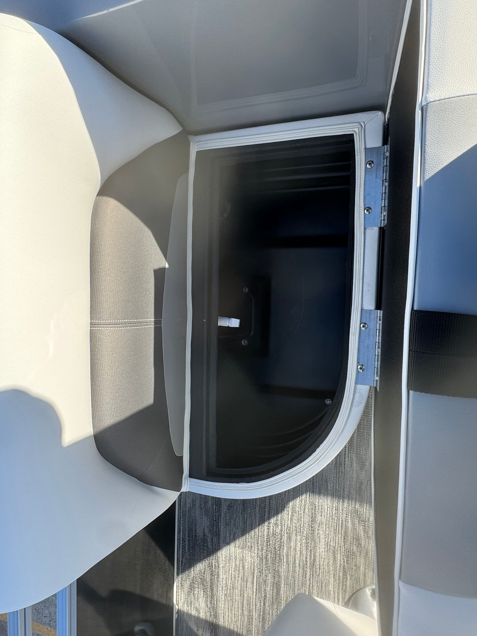 Interior of 2026 Landau 23C Atlantis with storage compartment.