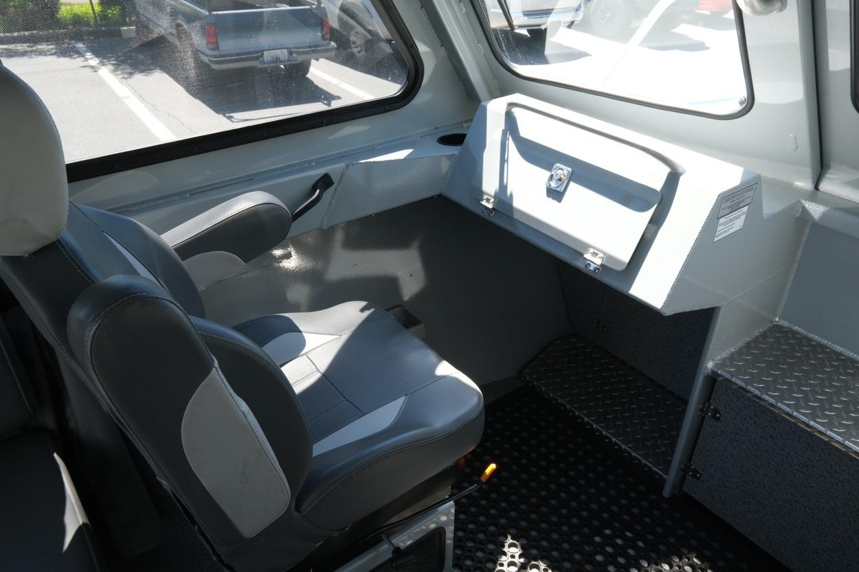 Interior of 2018 Hewescraft 220 Ocean Pro ET Hardtop, featuring seating and dashboard.