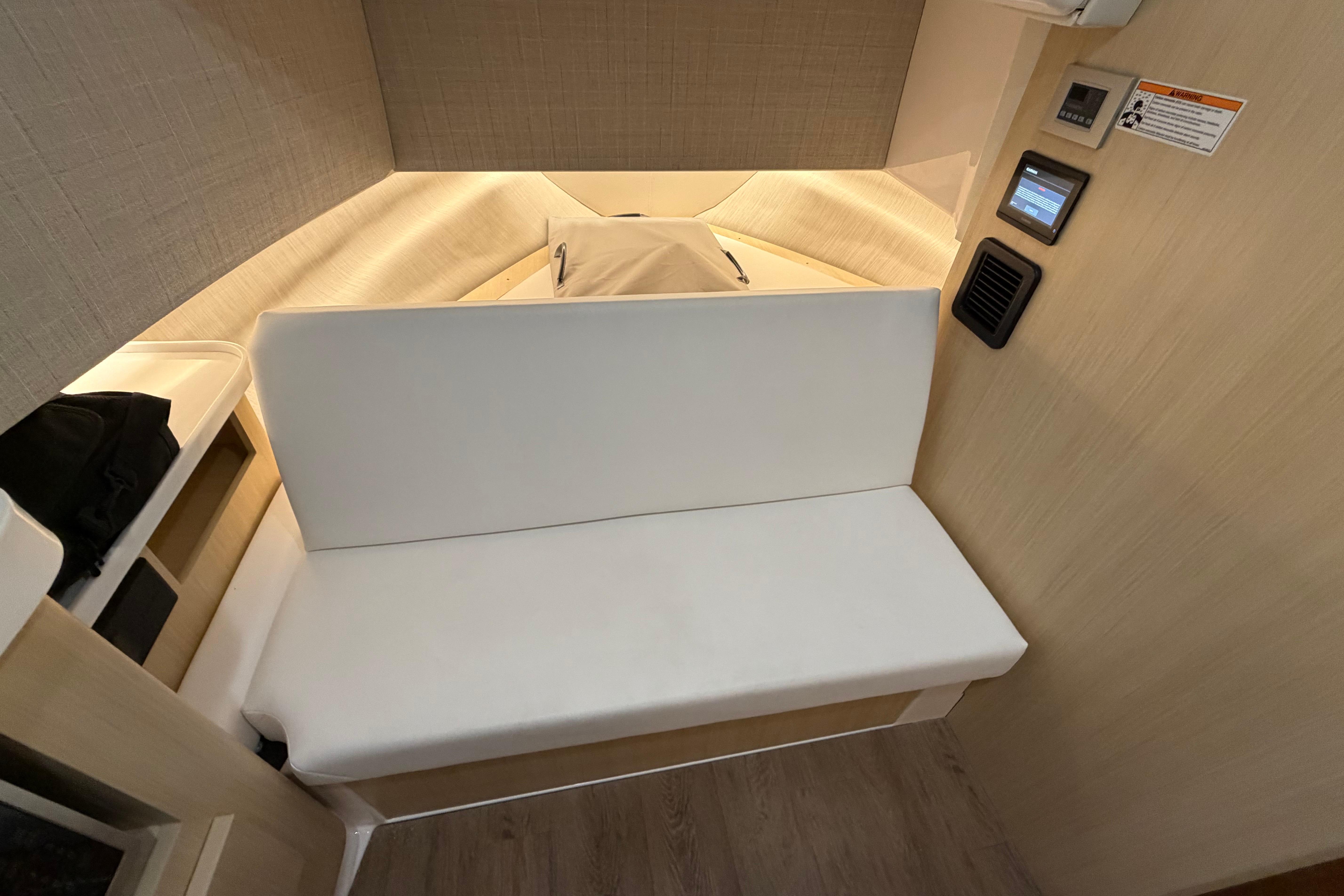 2027 Regal 38 Surf cabin interior with modern seating and control panel.