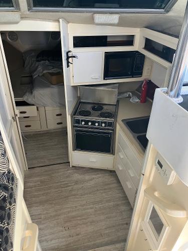 1985 Cruisers Yachts 338 Chateau Vee interior kitchen and sleeping area.