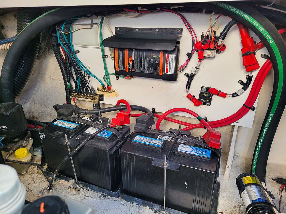 Battery compartment of a 2010 Sea Ray Sundancer 260 boat with wiring.