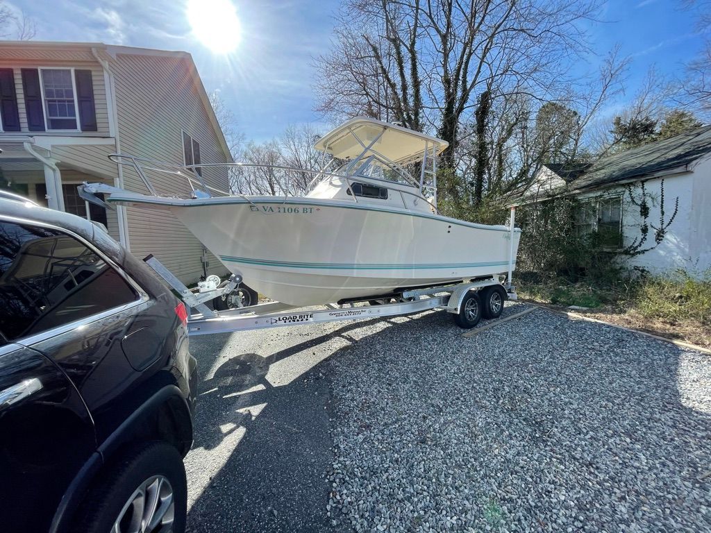 1999 KenCraft Challenger WA on trailer in driveway.