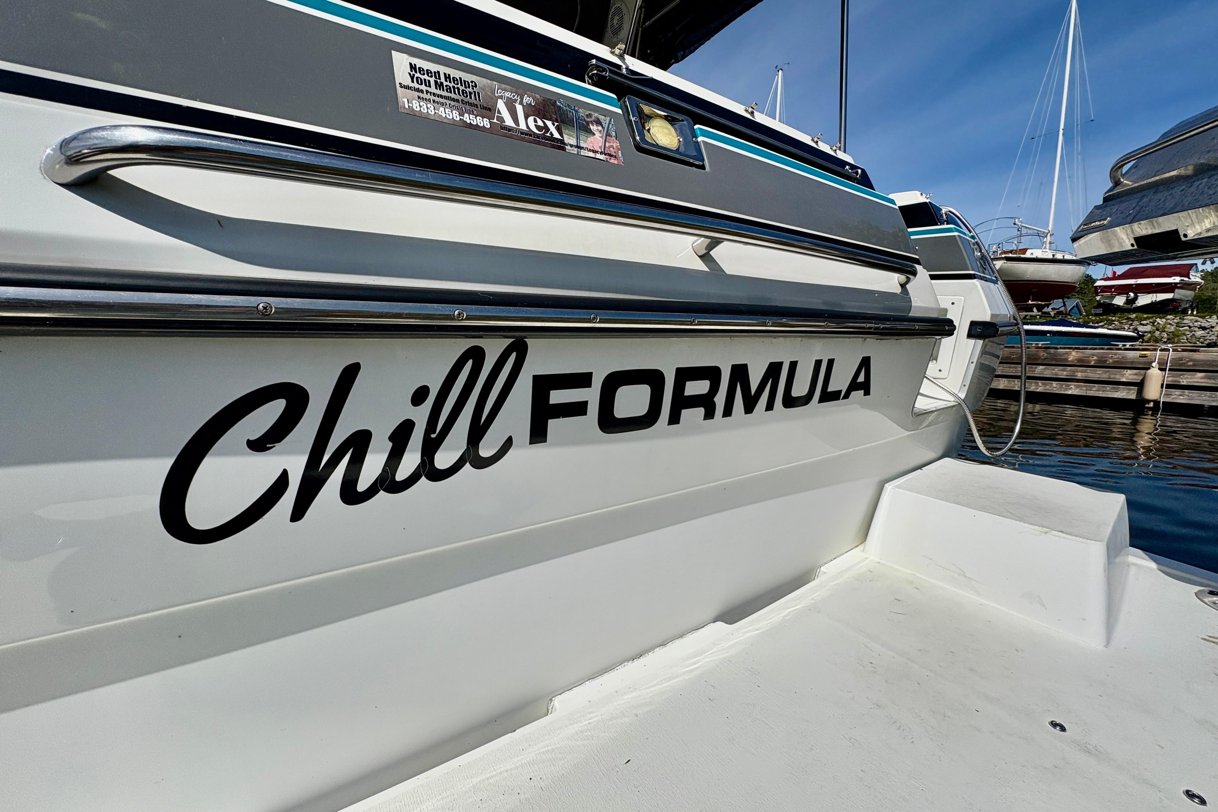 1989 Formula 35 PC boat docked, featuring "Chill Formula" text on the side.