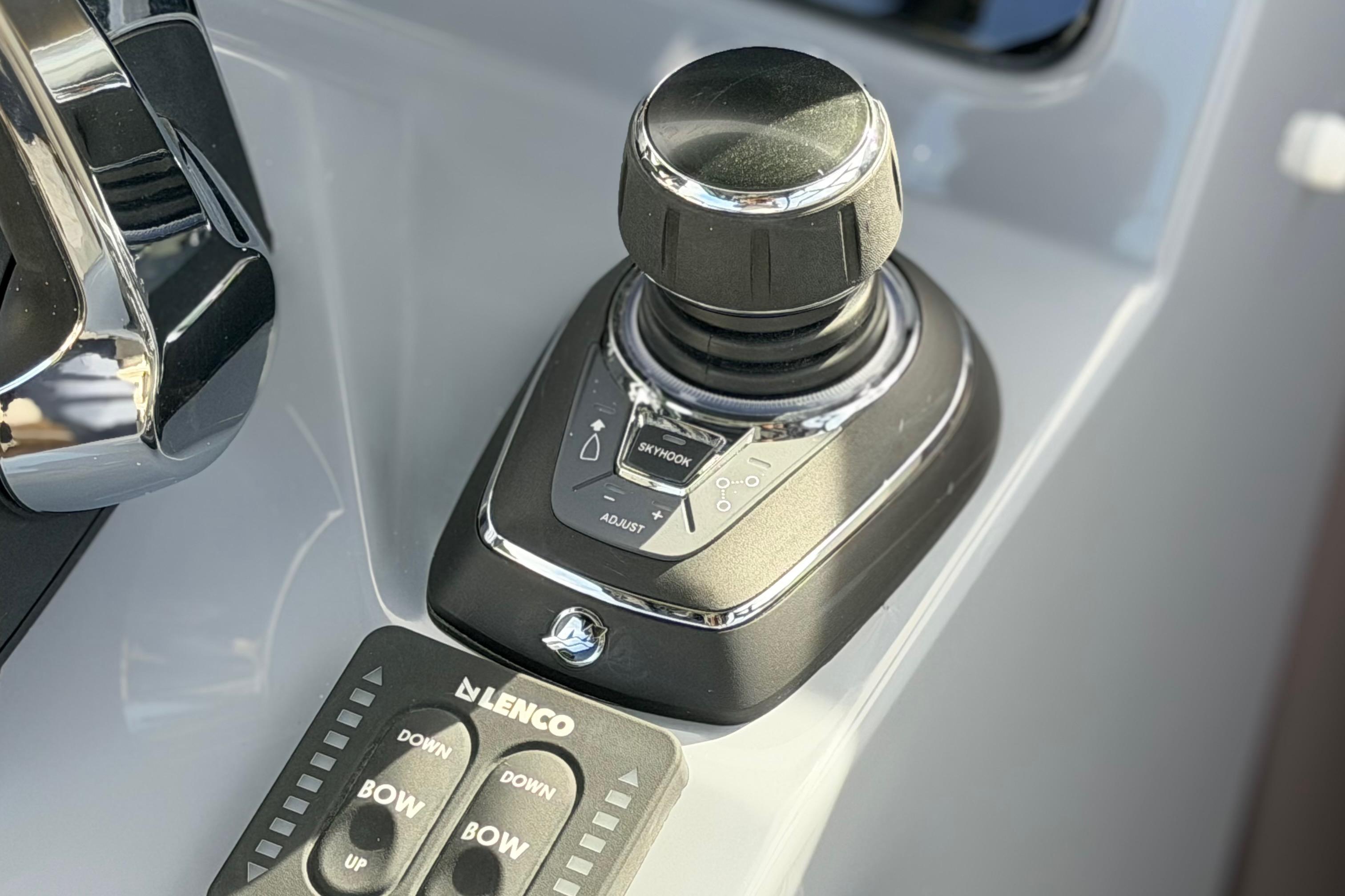 Control panel of 2026 Navan S30 boat with joystick and Lenco buttons.