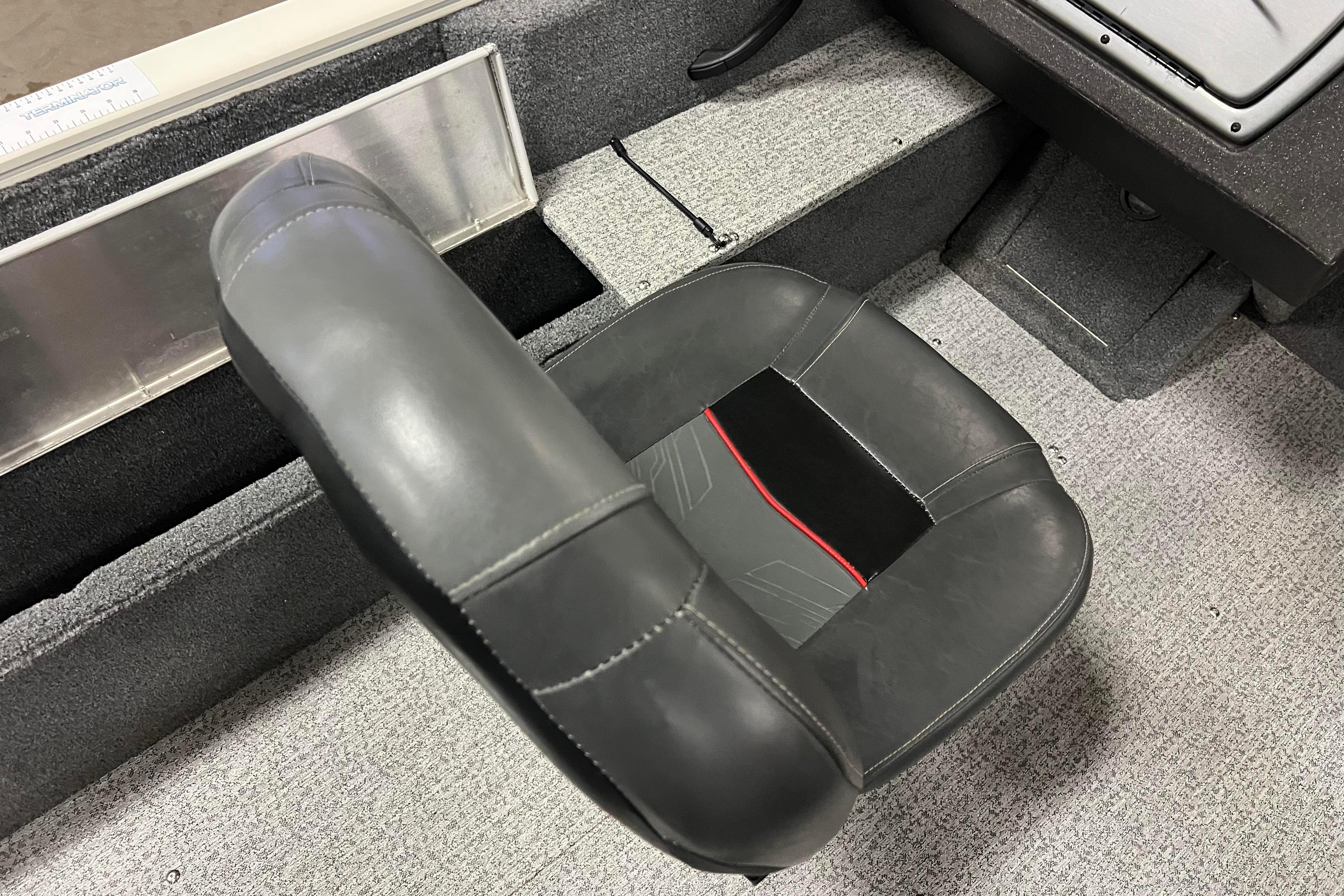 Boat seat in 2022 Tracker Pro Guide V-16 WT, featuring black and red design.
