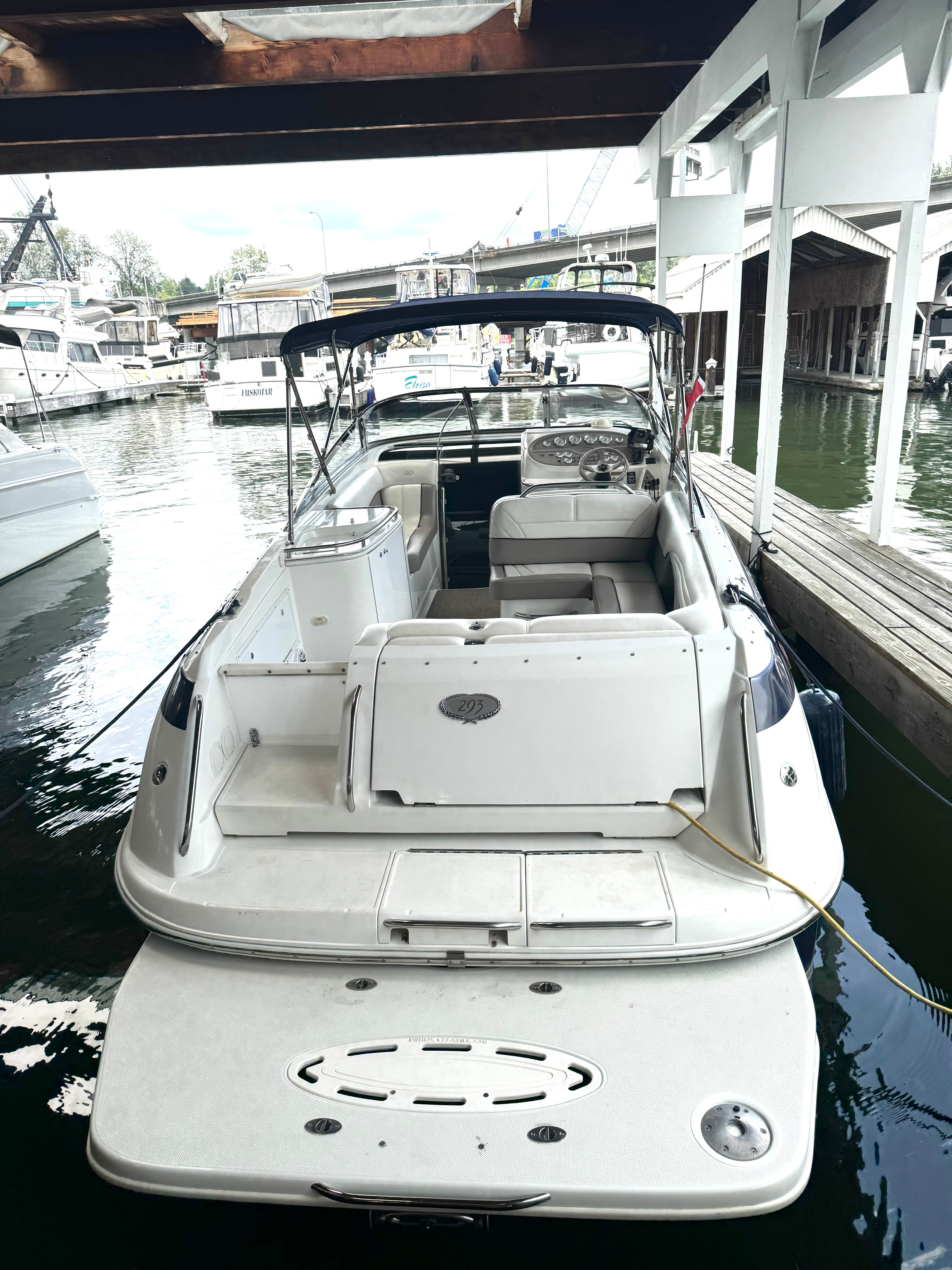 1999 Cobalt 293 boat docked, rear view.