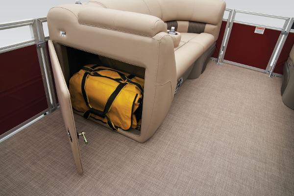 2024 Sun Tracker Party Barge 20 DLX storage compartment with yellow duffel bag.
