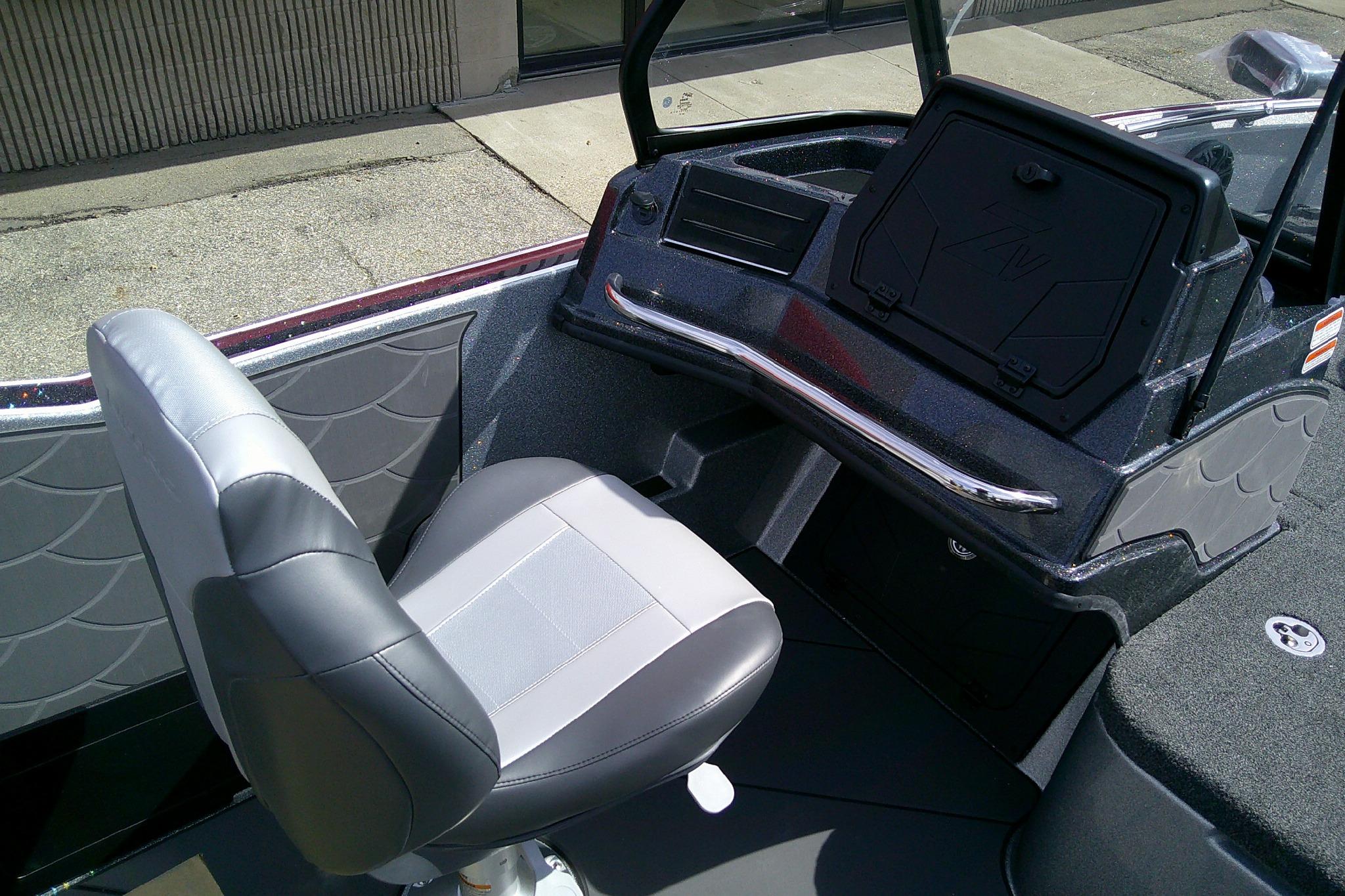 Interior of 2026 Nitro ZV21 Pro boat with gray seating and dashboard.