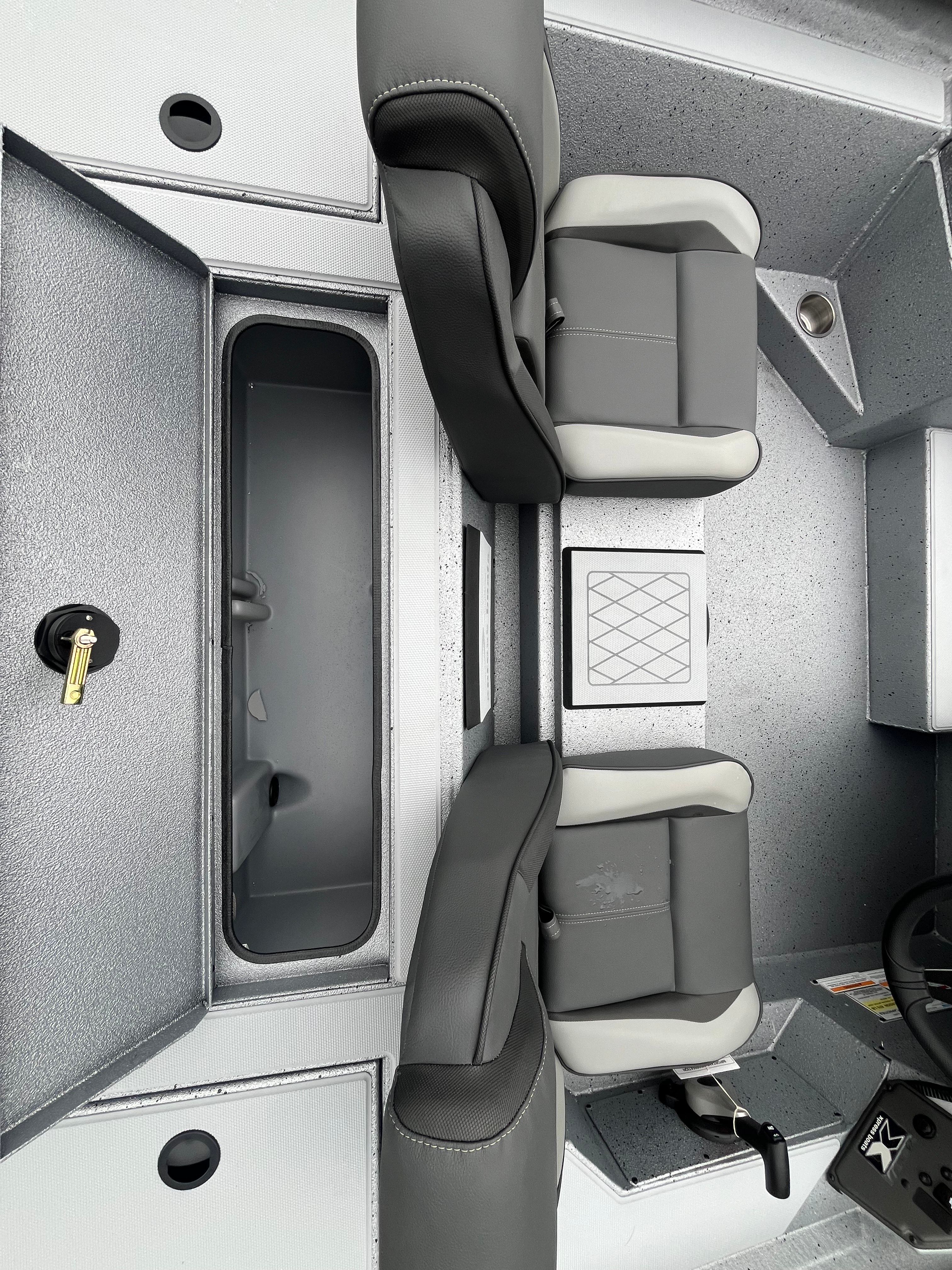 Interior of 2026 Xpress H18C Crappie with gray seats.