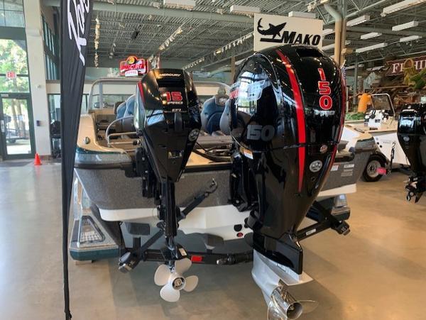 2024 Ranger 1850MS boat with dual Mercury outboard motors displayed indoors.