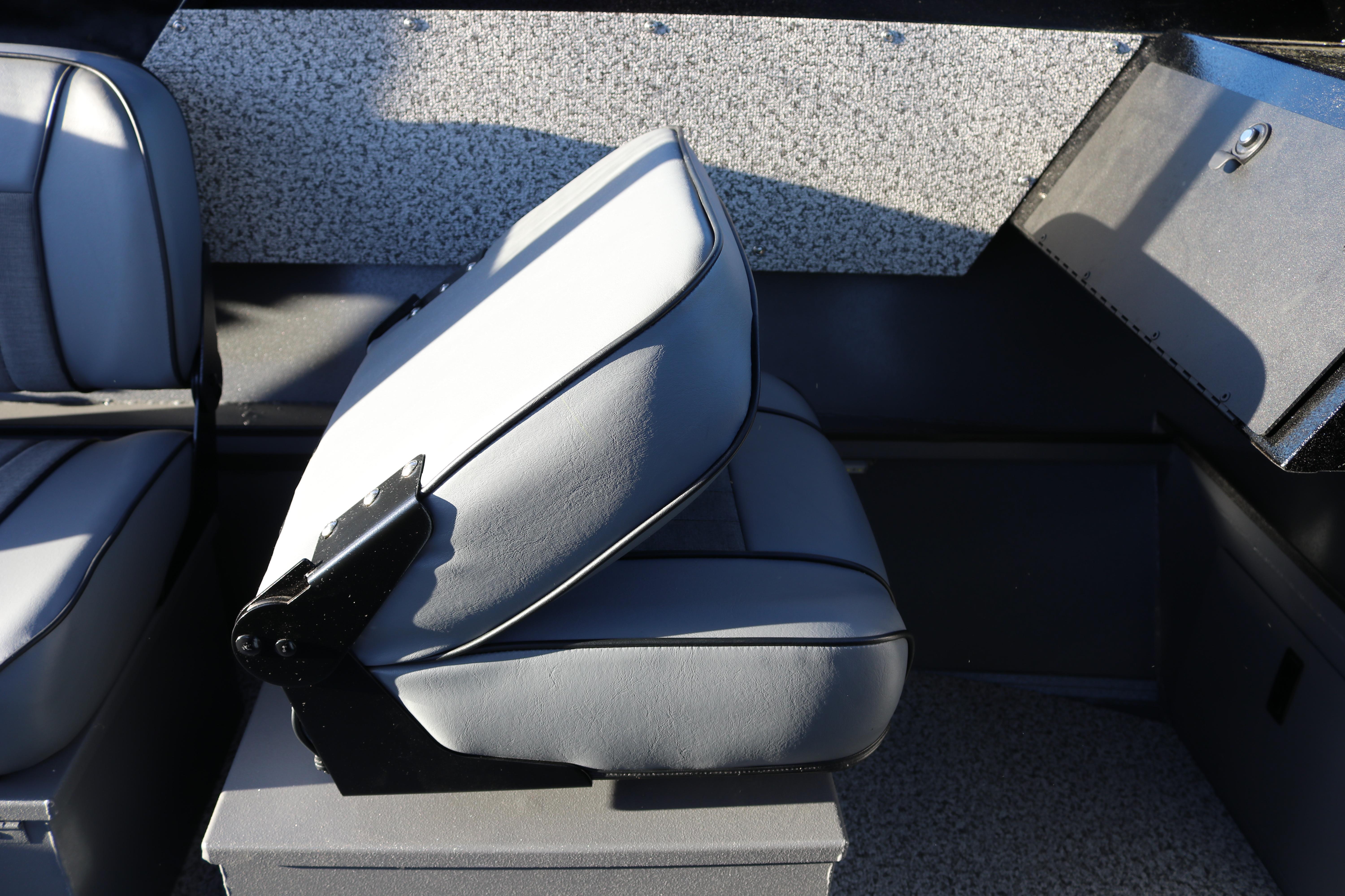 Interior seating of 2026 Alumaweld Stryker X202 boat, featuring gray cushioned seats.