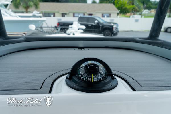 Compass on 2025 Caymas 281 HB boat dashboard, Black Label Marine Group logo visible.