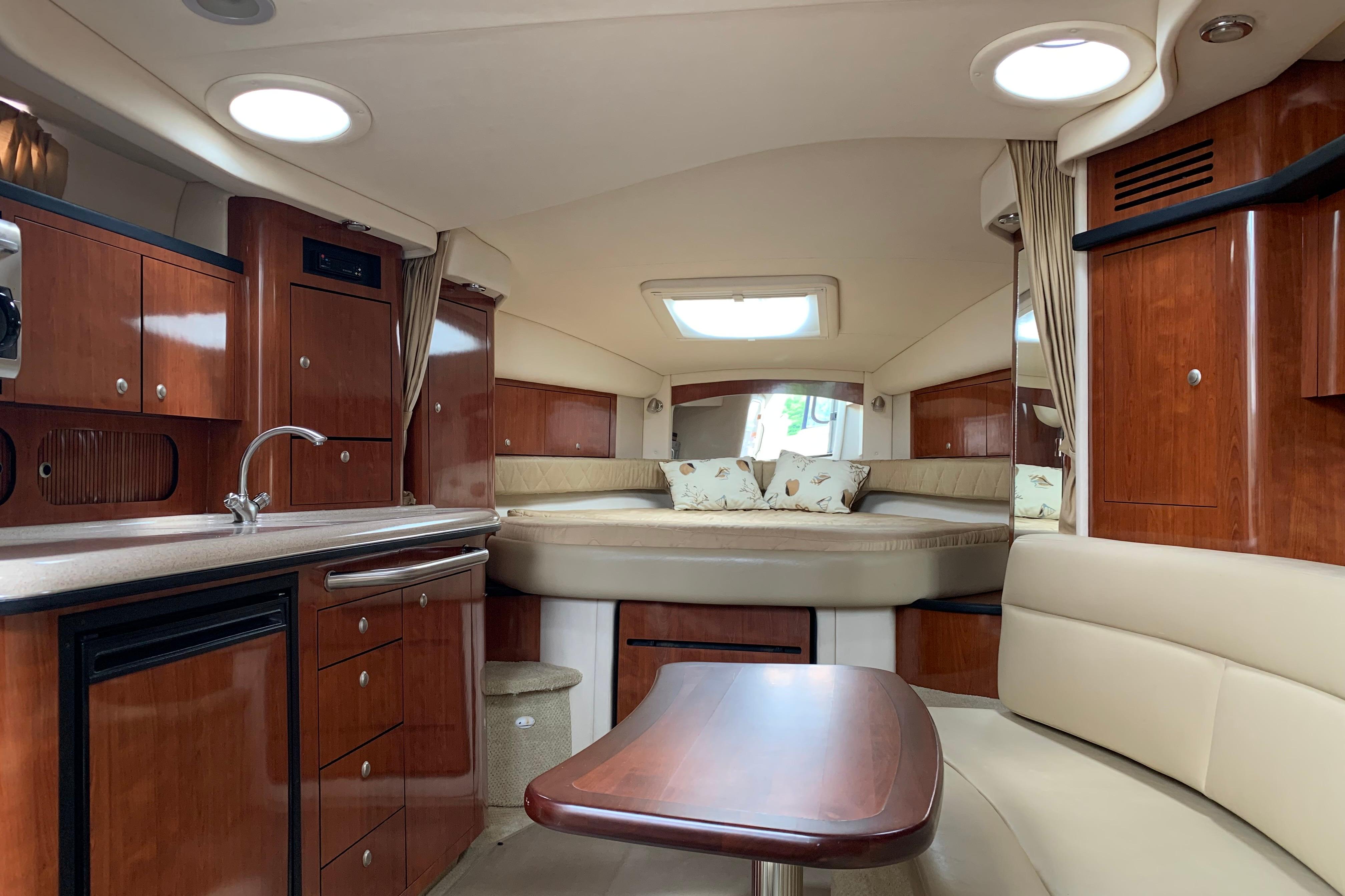 Luxurious interior of a 2007 Sea Ray 340 Sundancer yacht with elegant wood finishes.