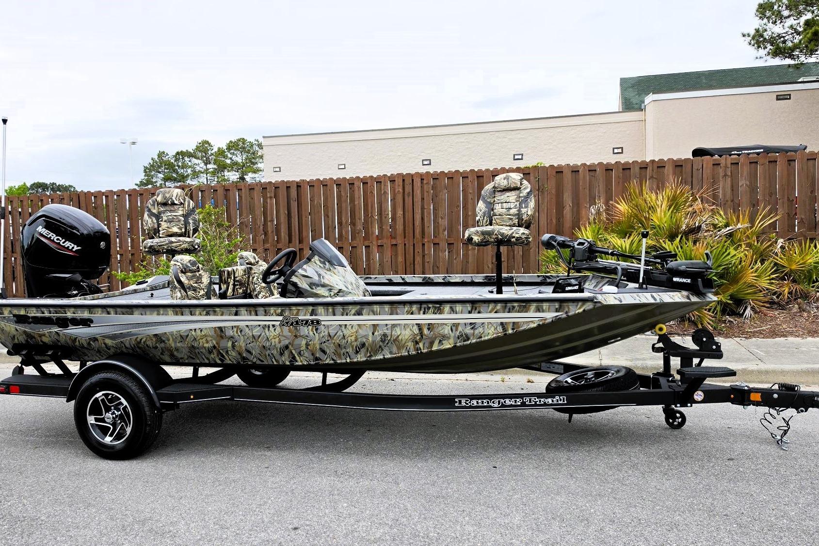 2026 Ranger RT178 fishing boat with camouflage design on a trailer.