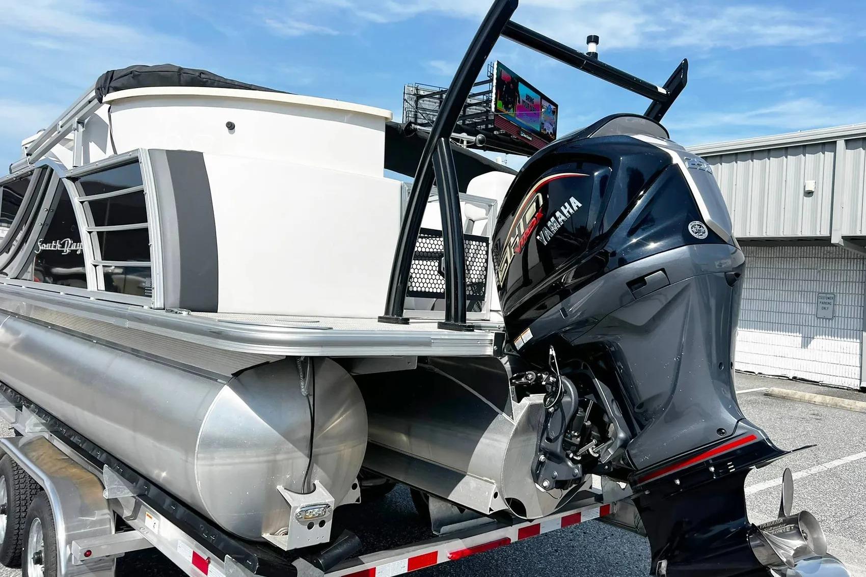 2023 South Bay 523 R pontoon boat with Yamaha outboard motor on a trailer.