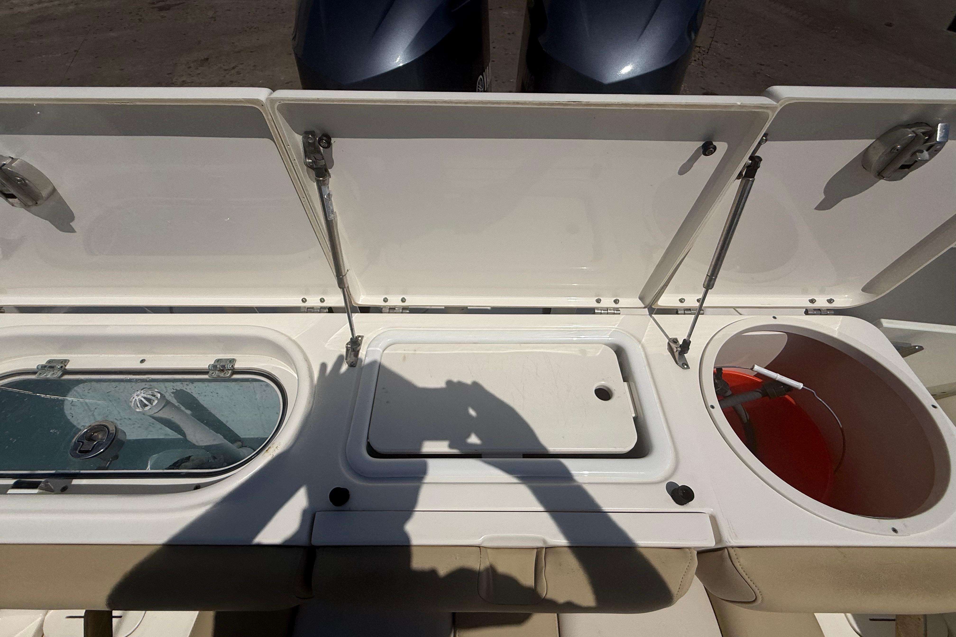 2019 Key West Billistic 281 Center Console boat storage compartments open.