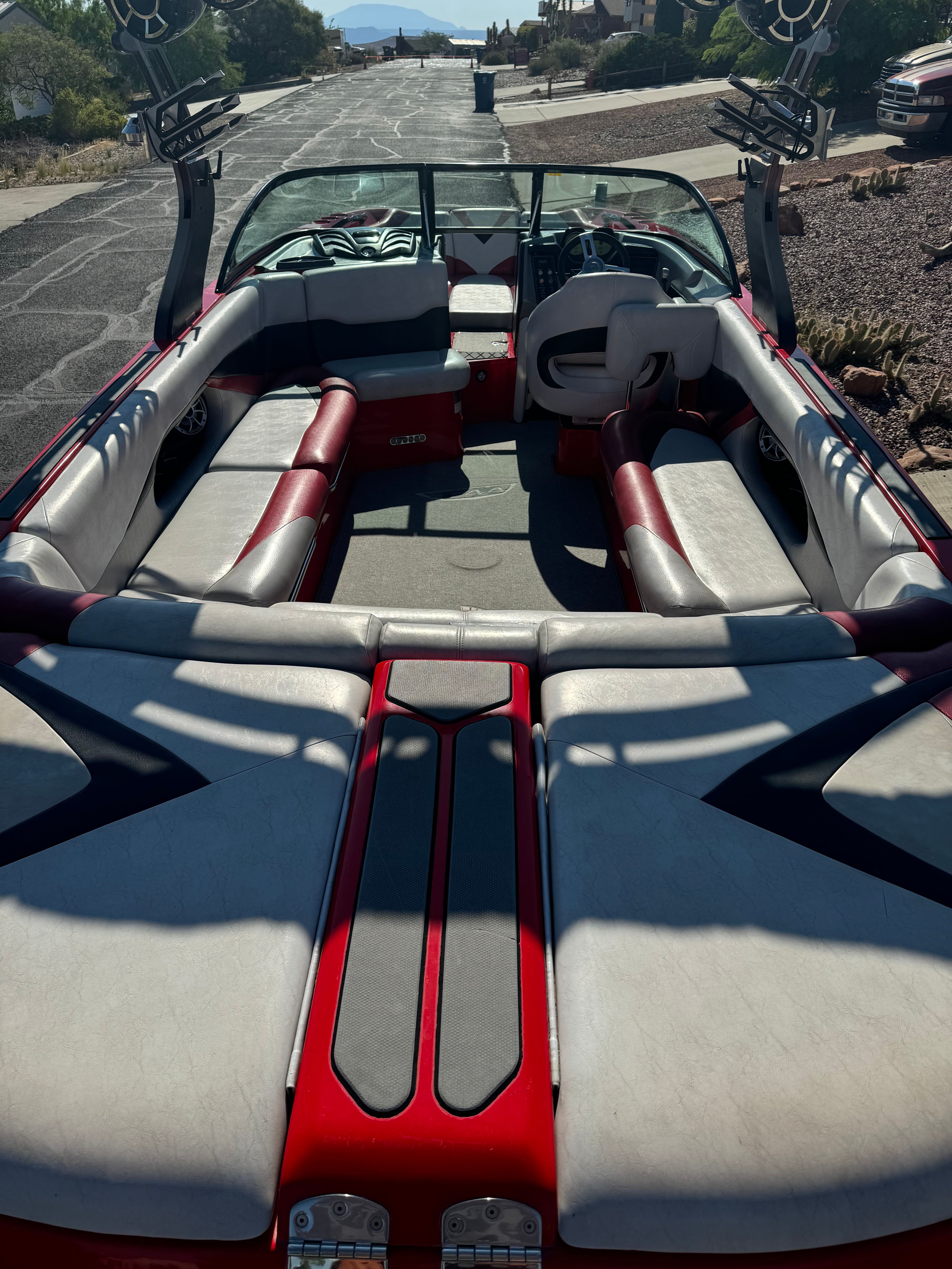 Interior of a 2014 Centurion Enzo FX44 boat with red and gray seating.