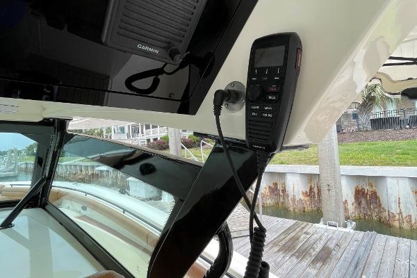 2020 Scout 420 LXF boat interior with Garmin marine electronics and communication device.