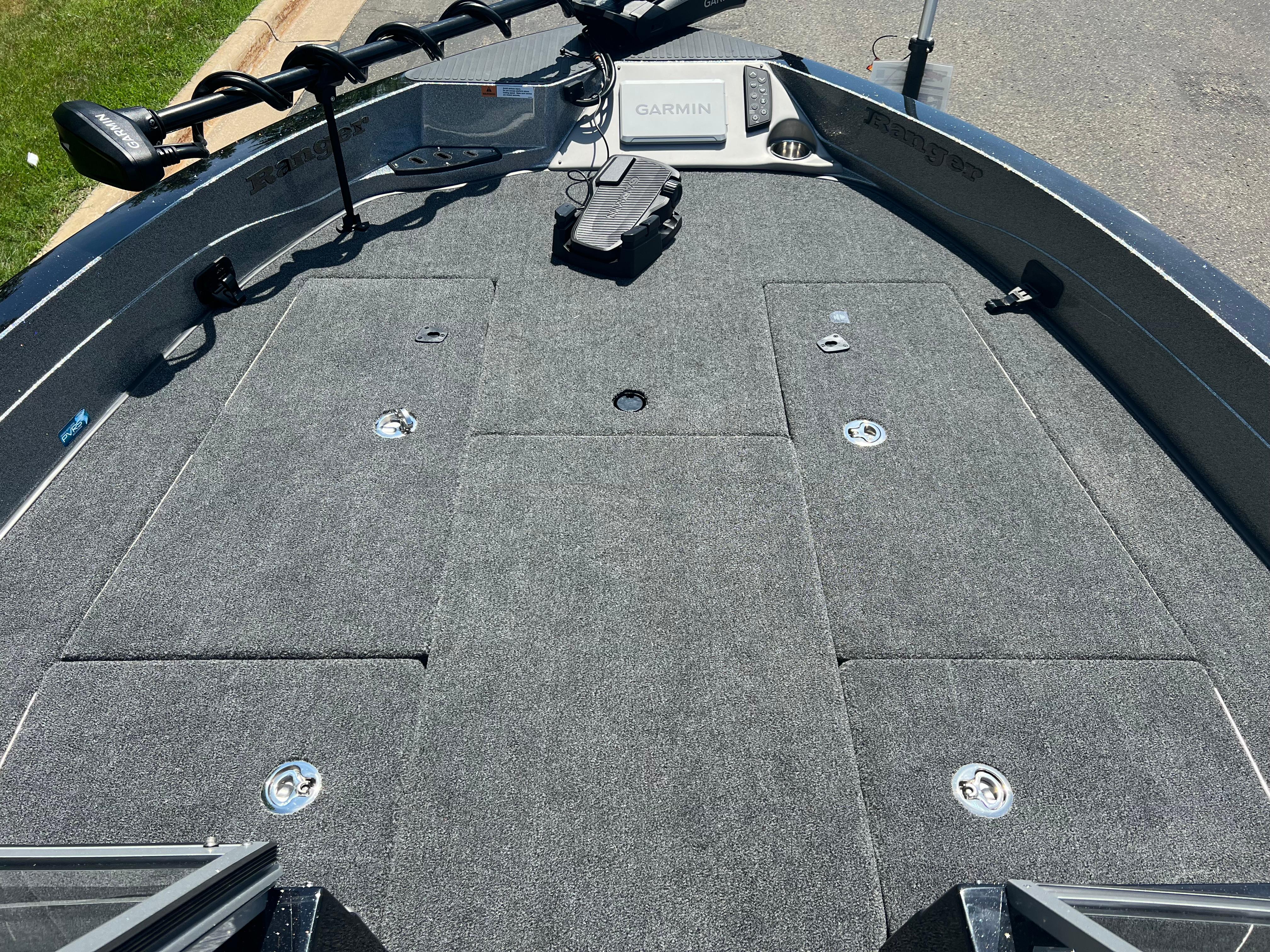 2025 Ranger 621FS Cup Equipped boat deck with Garmin system and carpeted surface.
