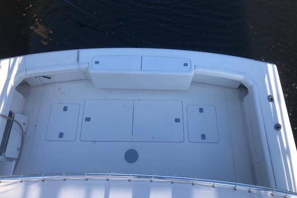1997 Bertram Convertible boat deck with storage compartments.