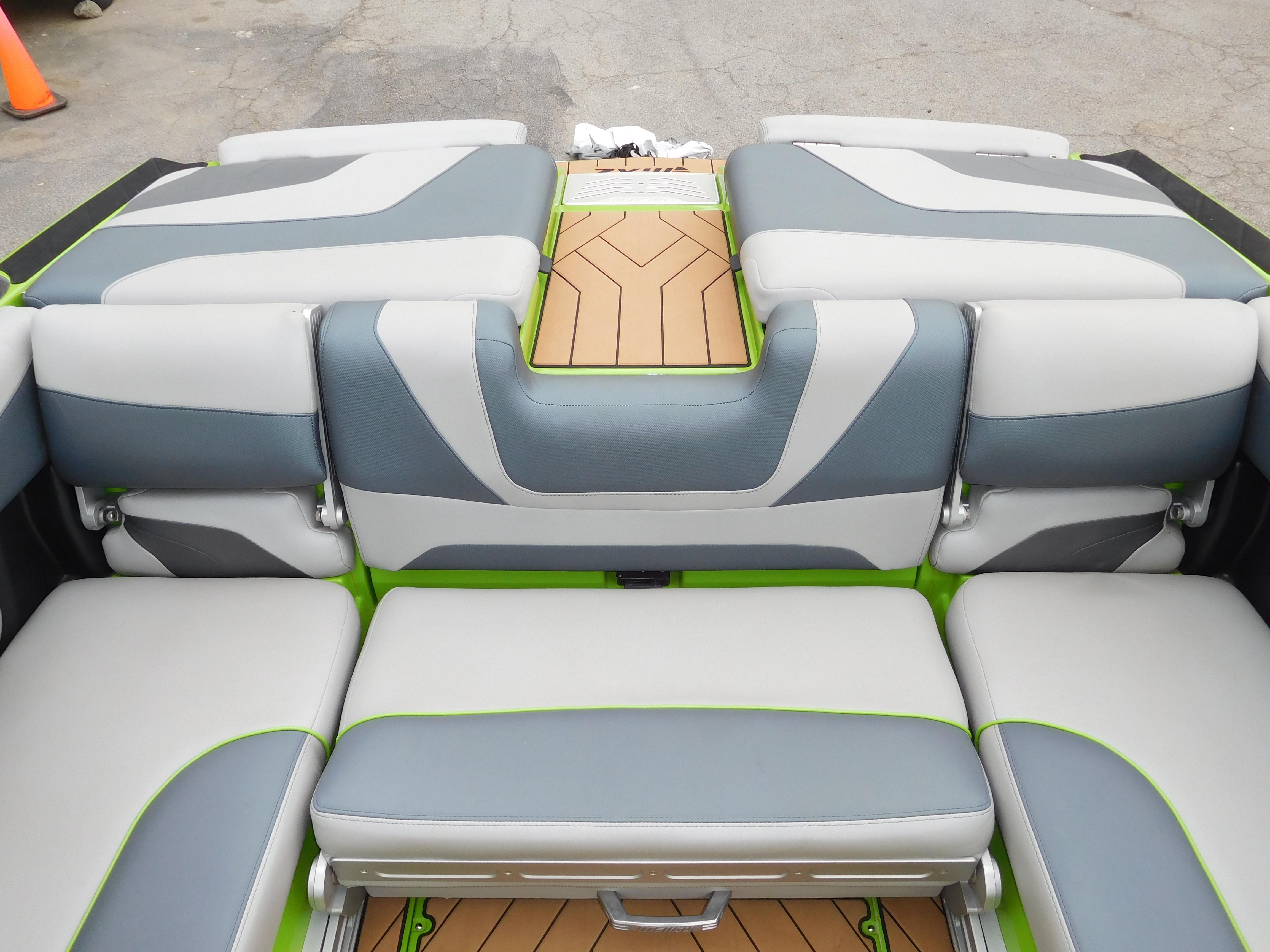 2017 Malibu Wakesetter 24 MXZ interior seating with gray and green accents.