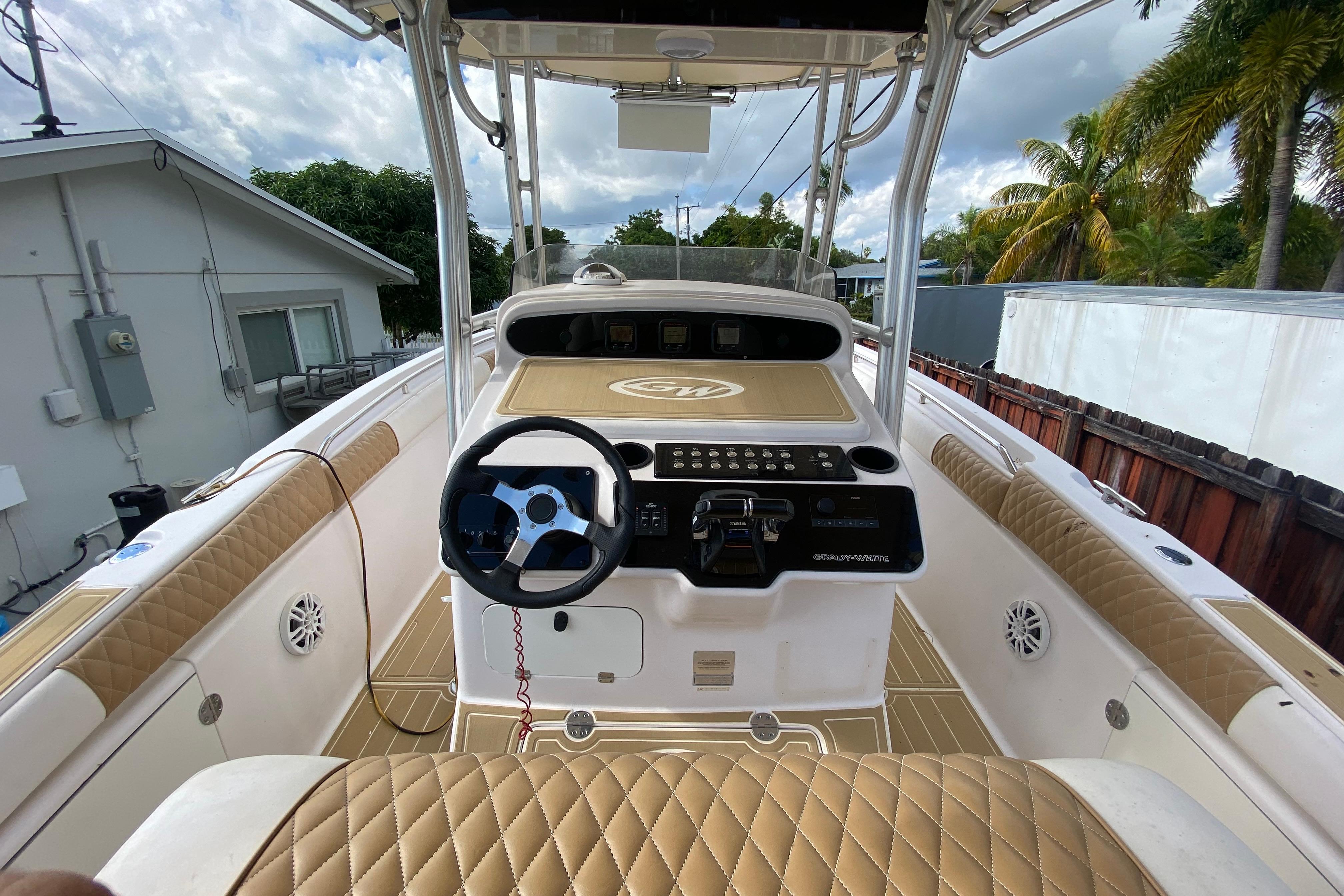 2004 Grady-White Canyon 283 boat interior with steering wheel and control panel.