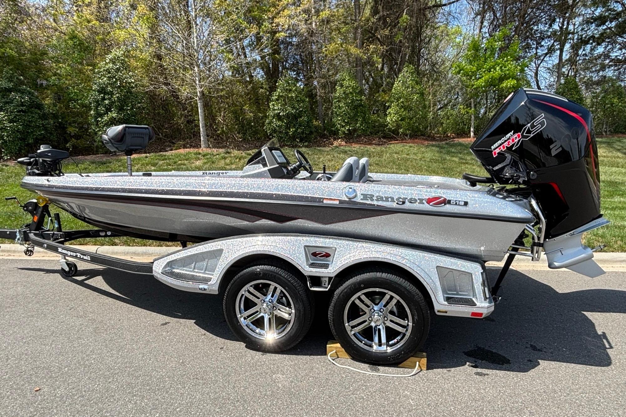 2026 Ranger Z518 Cup-Equipped boat on trailer, parked outdoors.