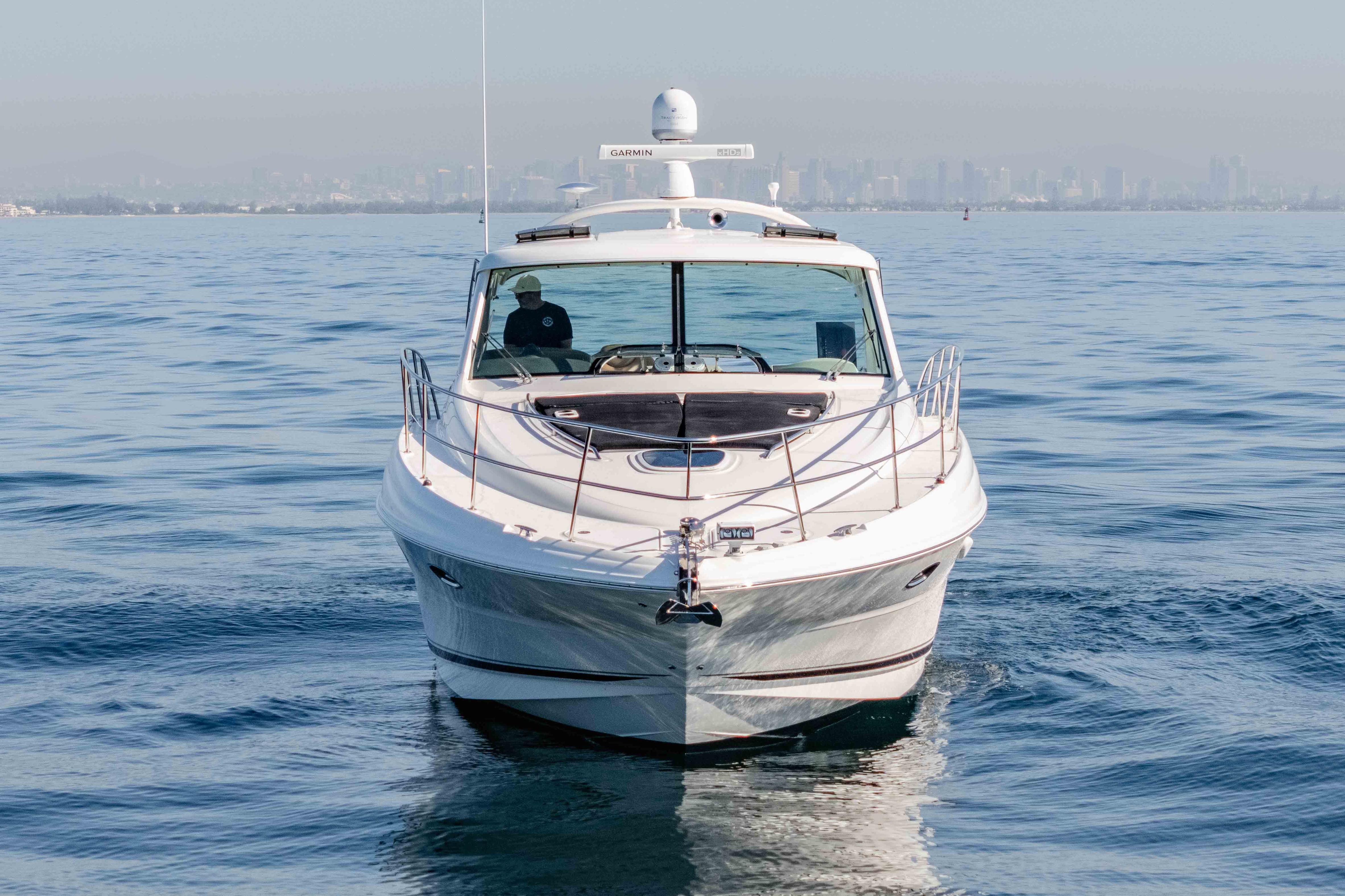 2007 Sea Ray 48 Sundancer yacht cruising on calm ocean waters.