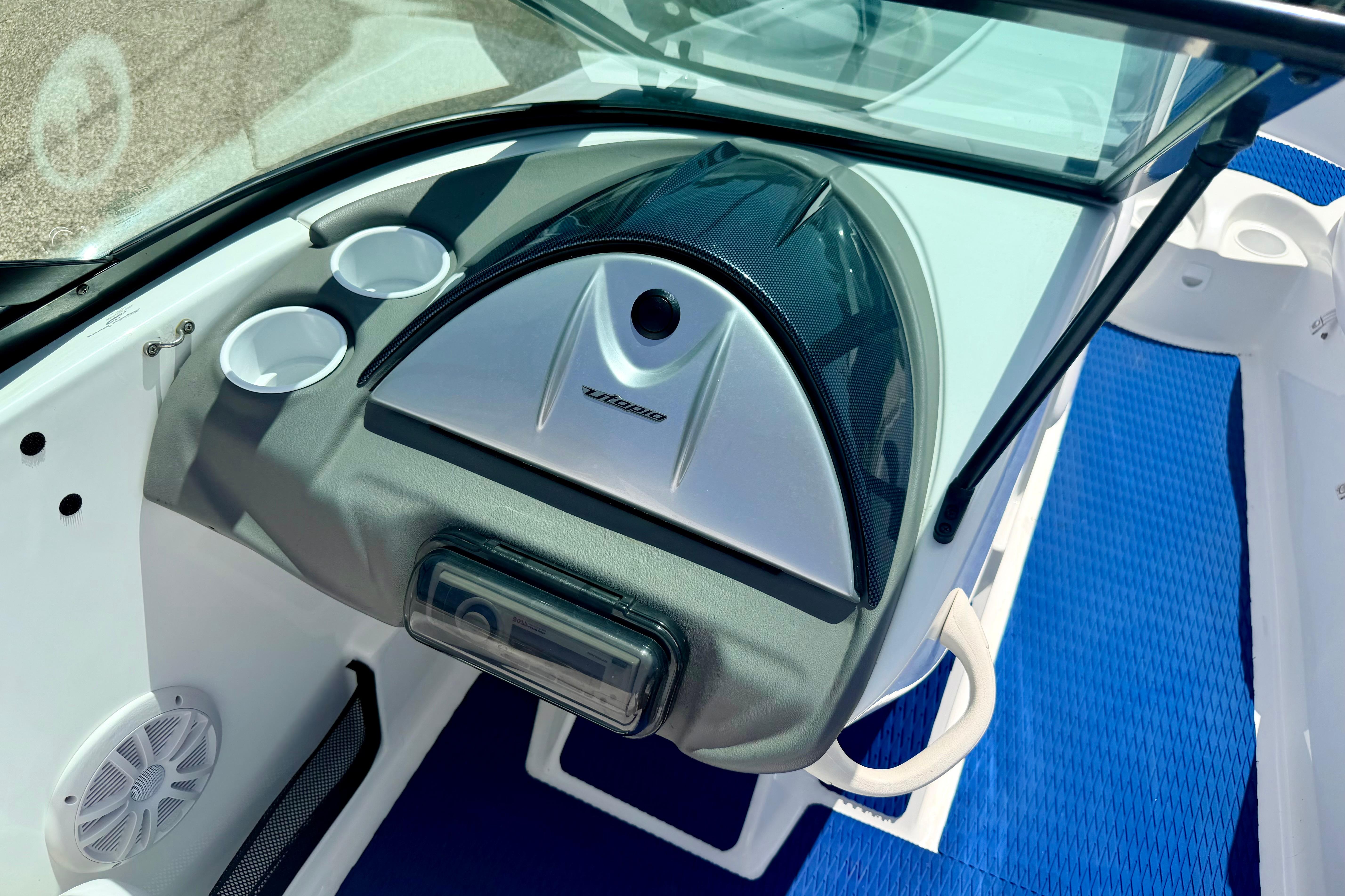 2004 Bombardier SEADOO Utopia 185 dashboard with cup holders and speaker.
