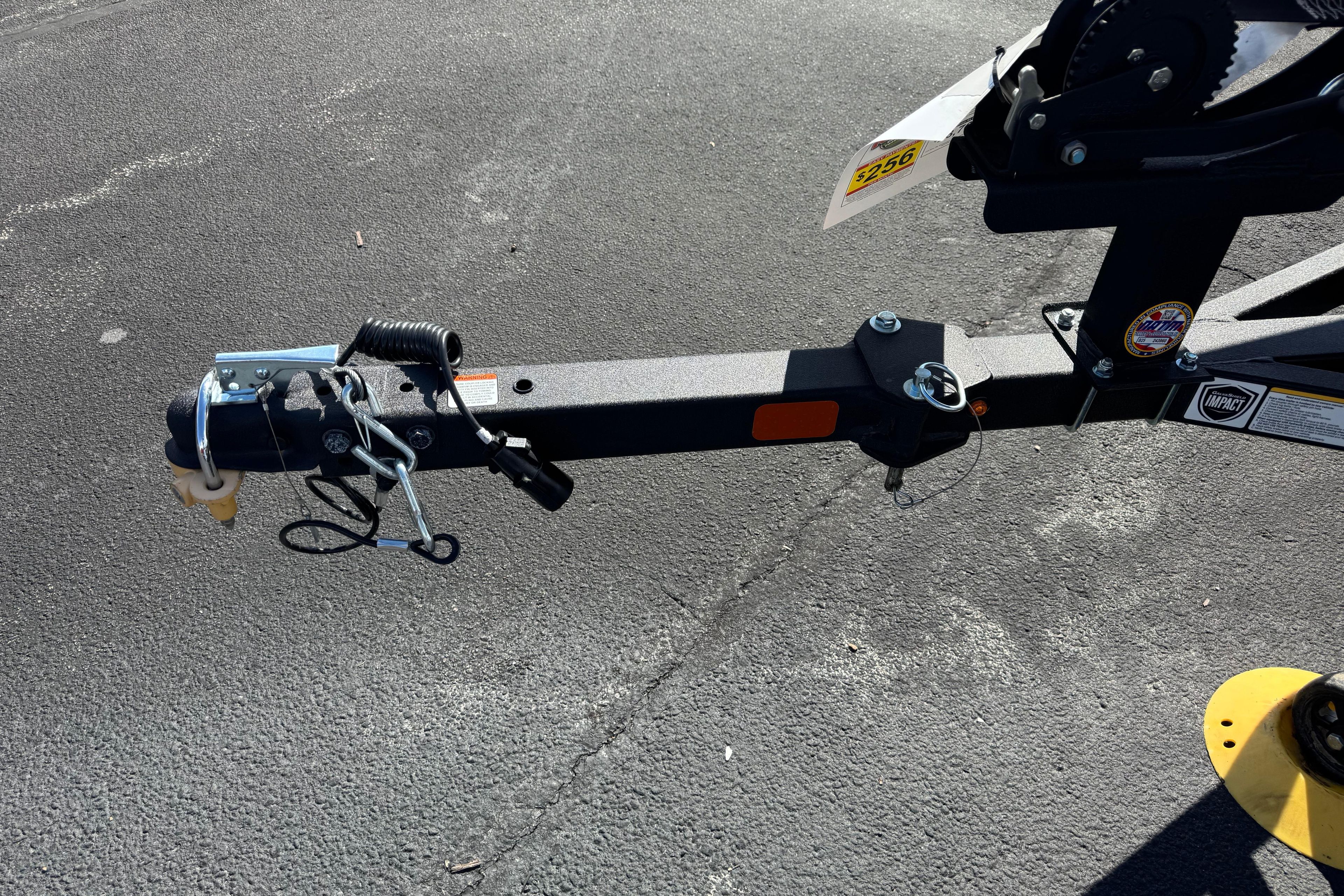 Trailer hitch of 2026 Tracker Pro Team 175 on asphalt surface.