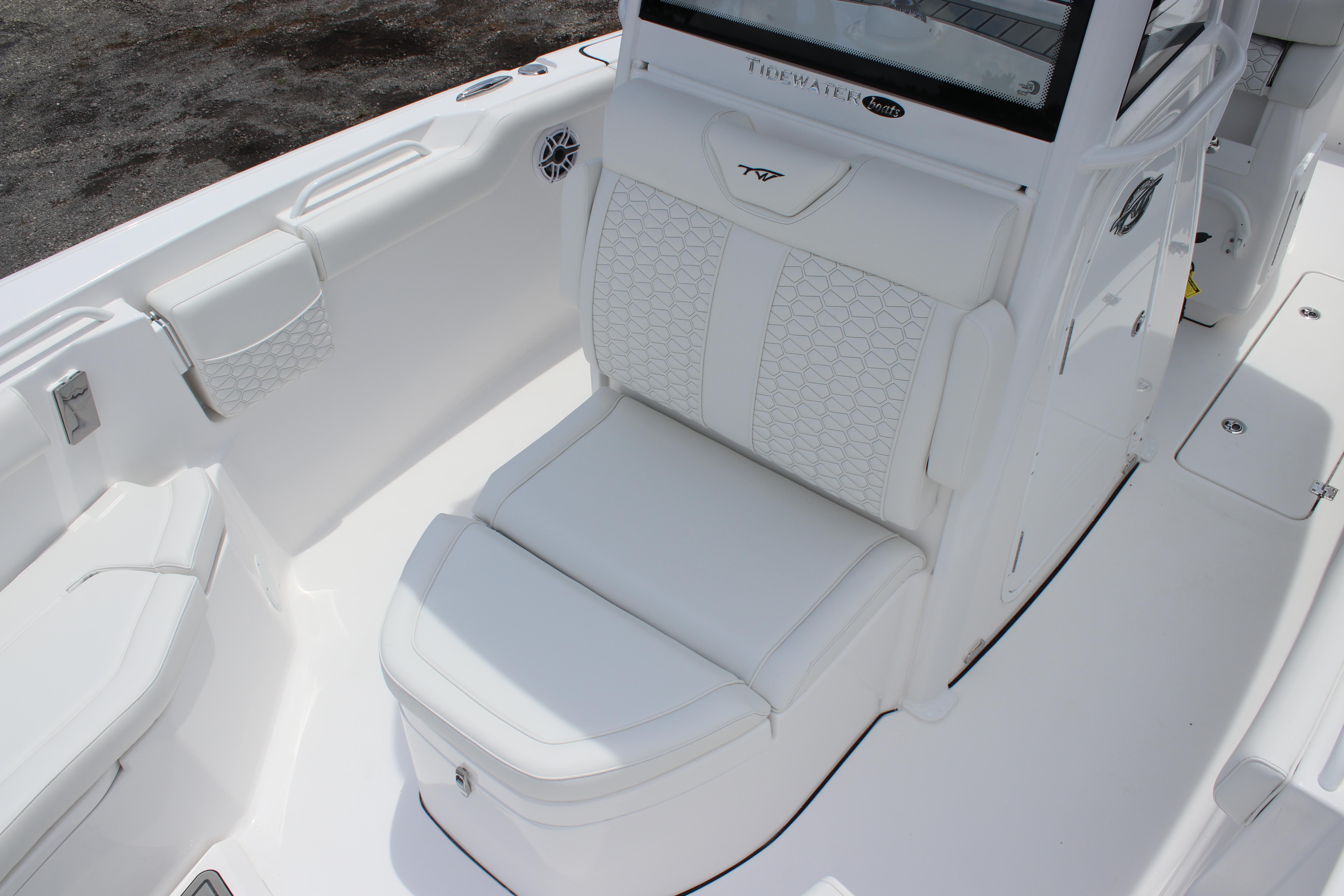 2026 Tidewater 272 LXF boat interior with white cushioned seating and sleek design.