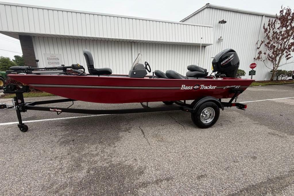 2026 Tracker Bass Tracker Classic XL boat, red, parked outdoors on a trailer.