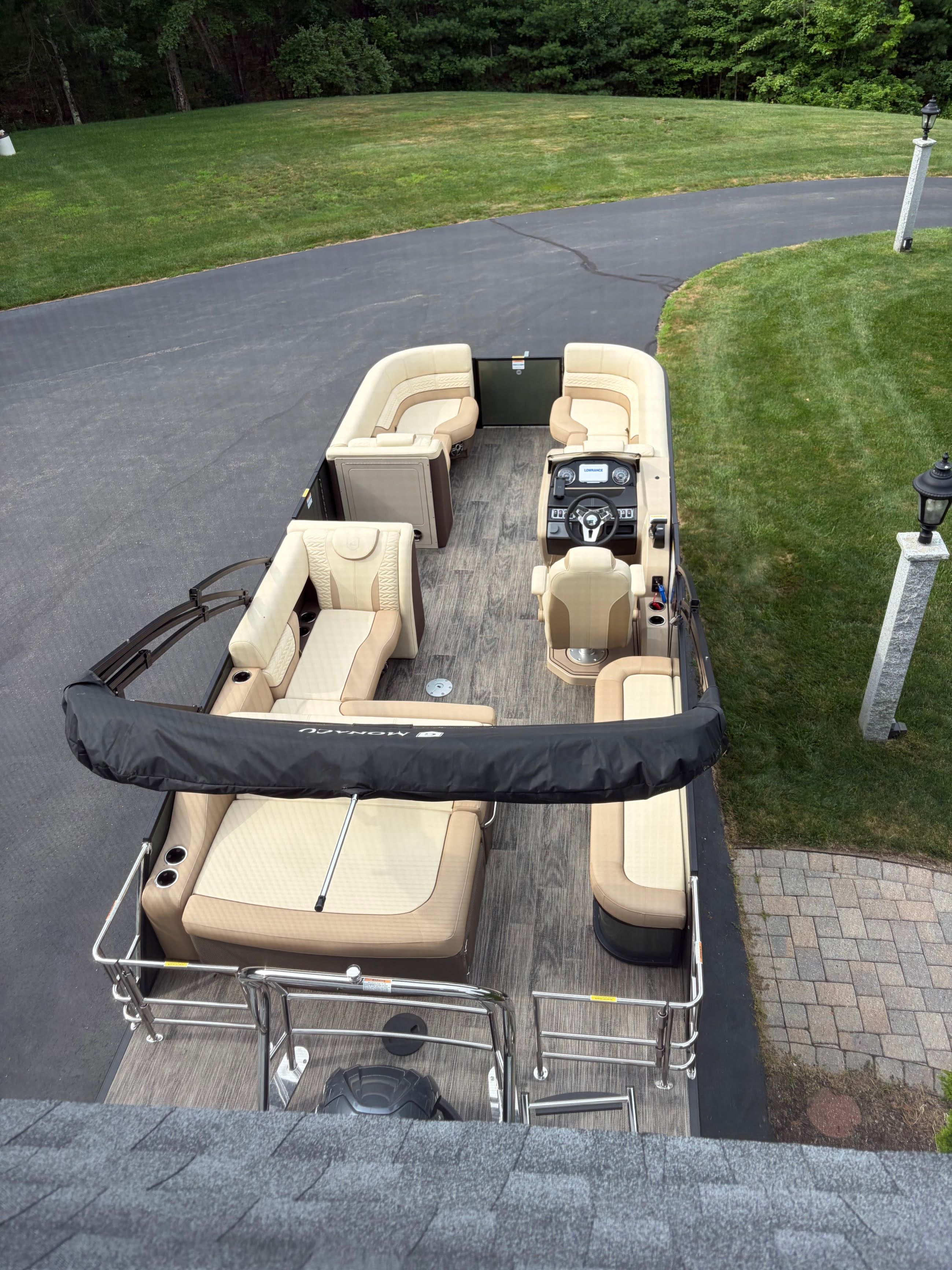 Godfrey Monaco Cruise 2025 pontoon boat with spacious deck and beige seating.