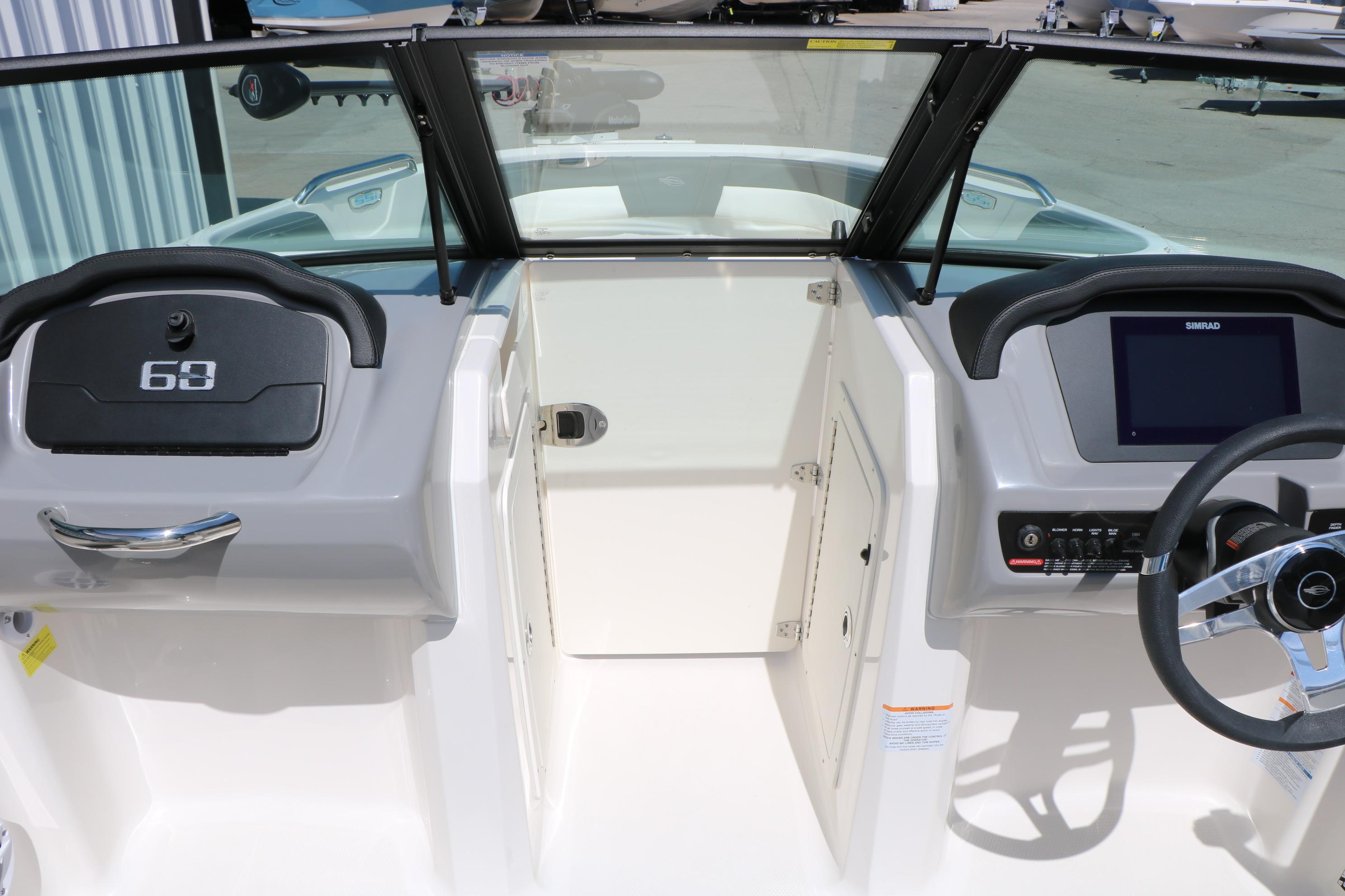 2025 Chaparral 21 SSi Ski & Fish boat dashboard with steering wheel and control panel.