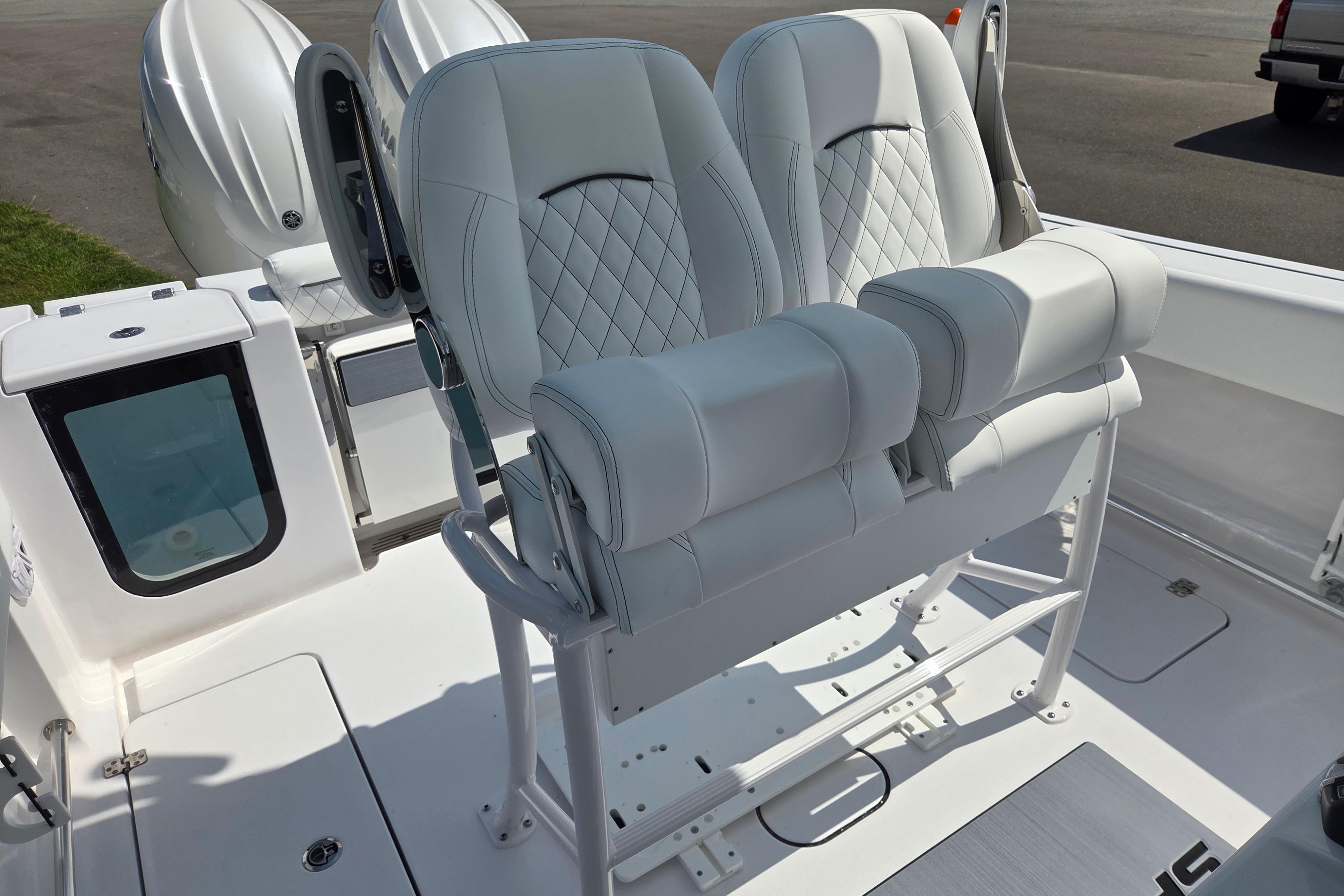 2026 Sportsman Open 252 Center Console boat with dual cushioned seats and sleek design.