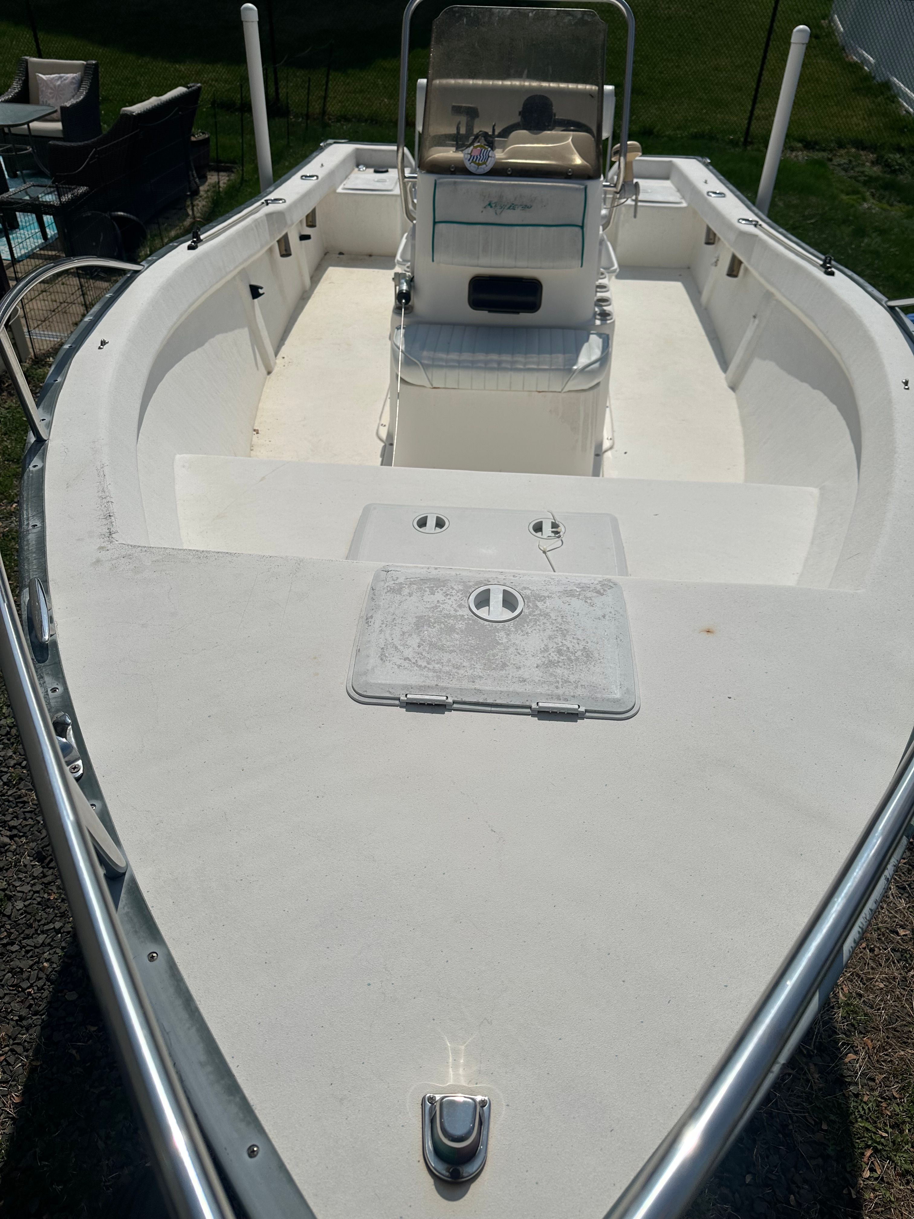 A 2003 Key Largo 180 Center Console boat with an open deck and steering console.