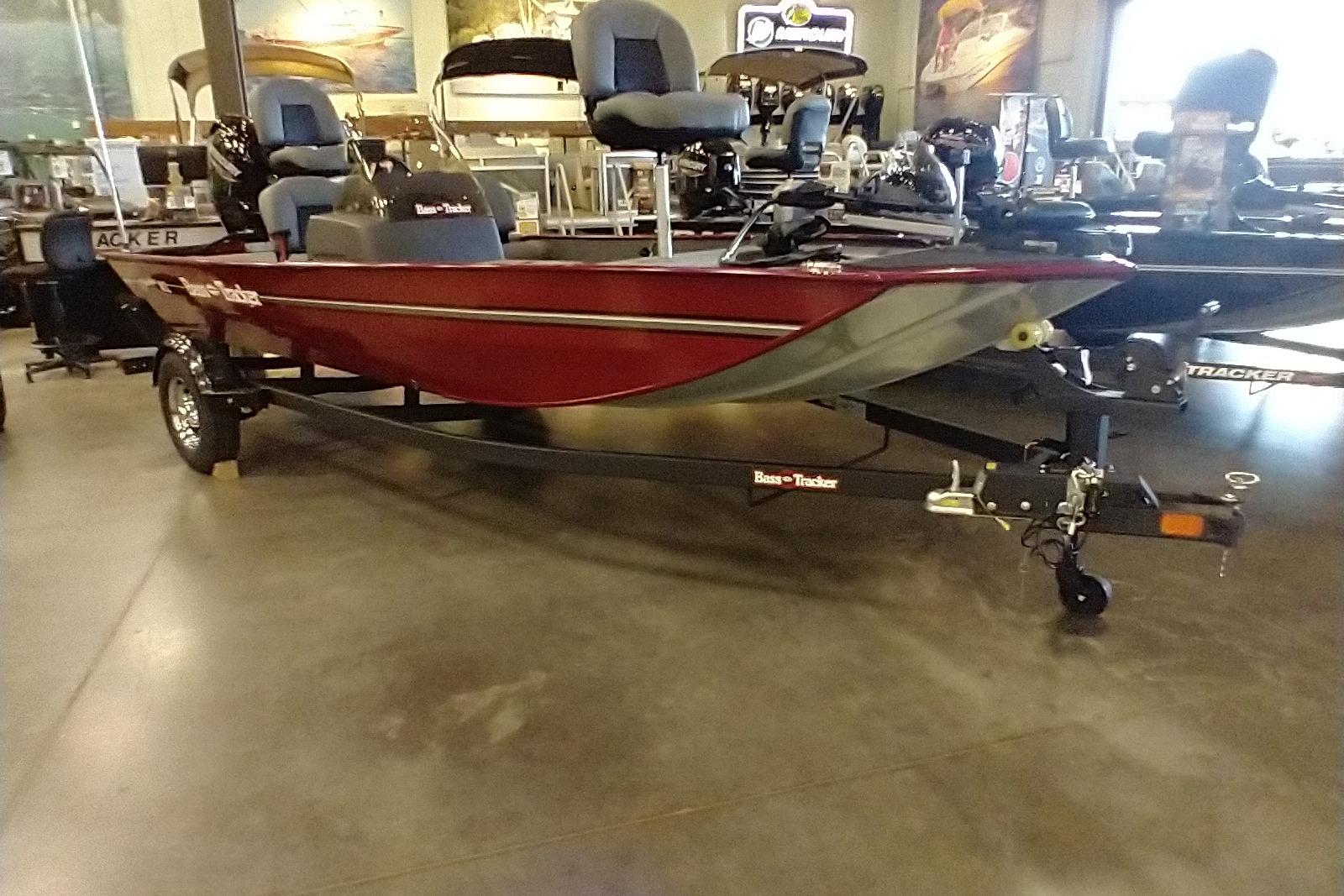 2026 Tracker Bass Tracker Classic XL boat in showroom, red exterior, on trailer.